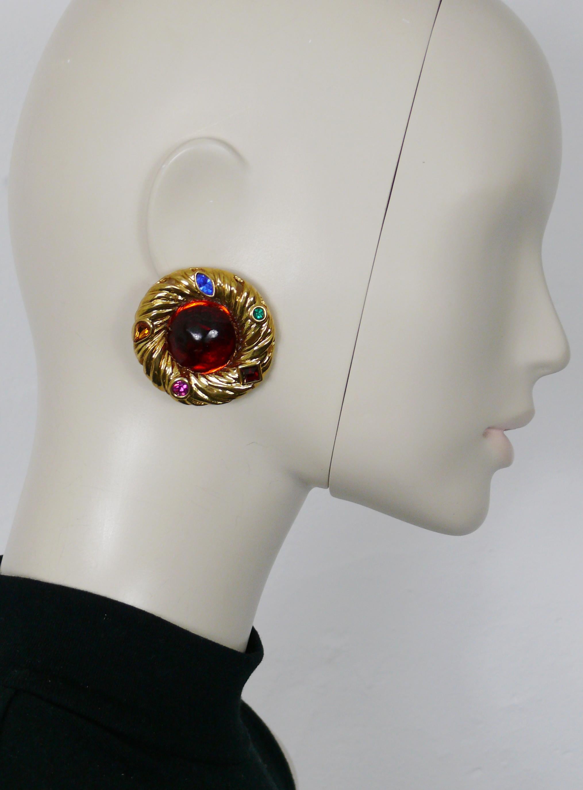 YVES SAINT LAURENT vintage gold toned nest design clip-on earrings embellished with a large red resin cabochon at center surrounded by multicolored crystals.

Embossed YSL Made in France.

Indicative measurements : diameter approx. 4.5 cm (1.77