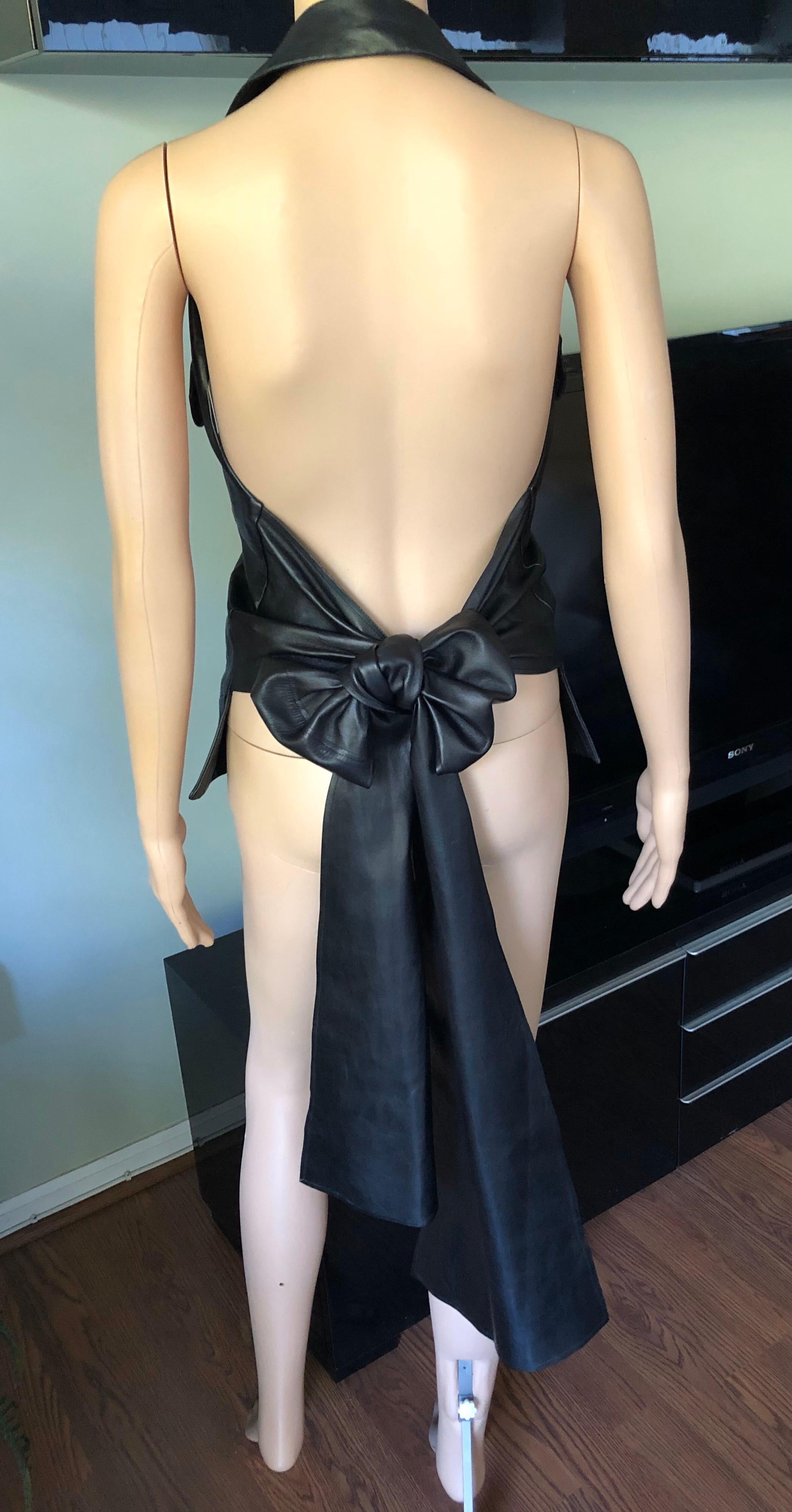Yves Saint Laurent YSL Leather Halter Backless Vest Top FR 36

Yves Saint Laurent leather halter vest top featuring plunging neckline, collar, dual slit pockets at side and tie closure at back.