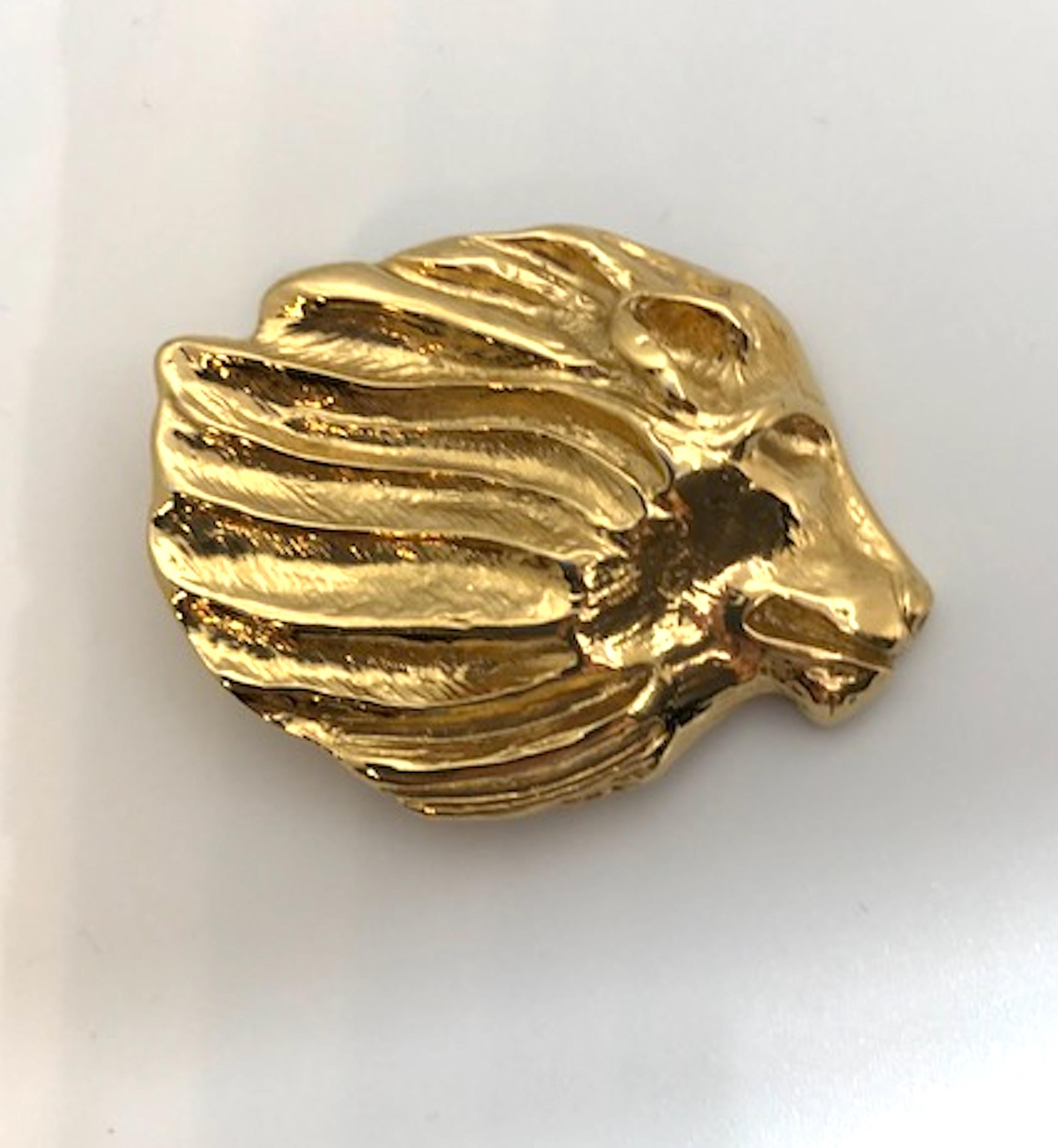 A beautifully crafted pair of 1980 / 90s Yves Saint Laurent lion face profile earrings. Each earring carved and cast separately. They are not identical. There is a right and left earring as they are mirror images meant to face each other when worn.