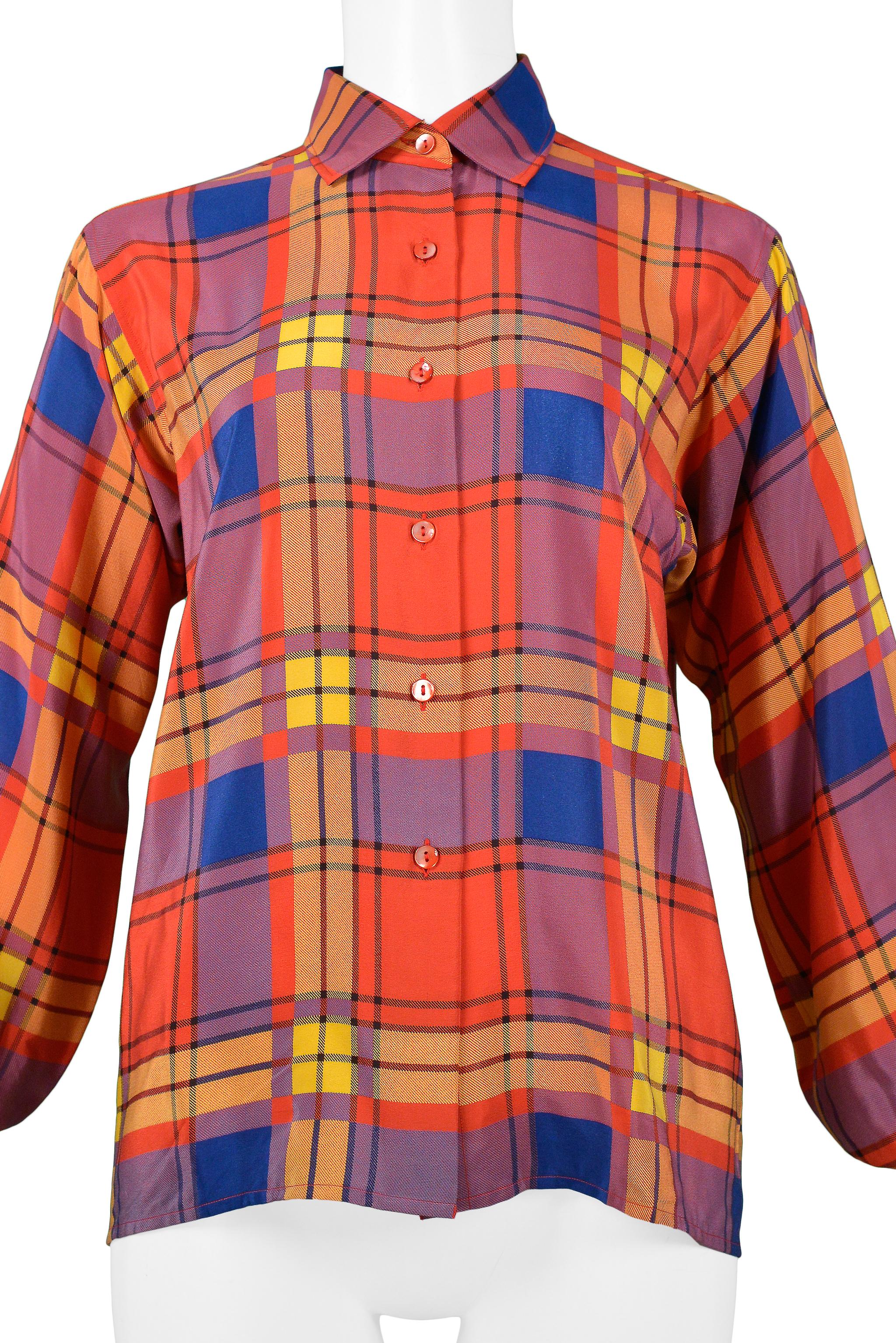 Resurrection Vintage is excited to offer a vintage Yves Saint Laurent red, yellow and blue plaid silk button-front blouse. 

Yves Saint Laurent
Size 38
Measurements: Shoulders 16”, Bust 37”, Waist Free 
Silk
Excellent Vintage Condition
Appears