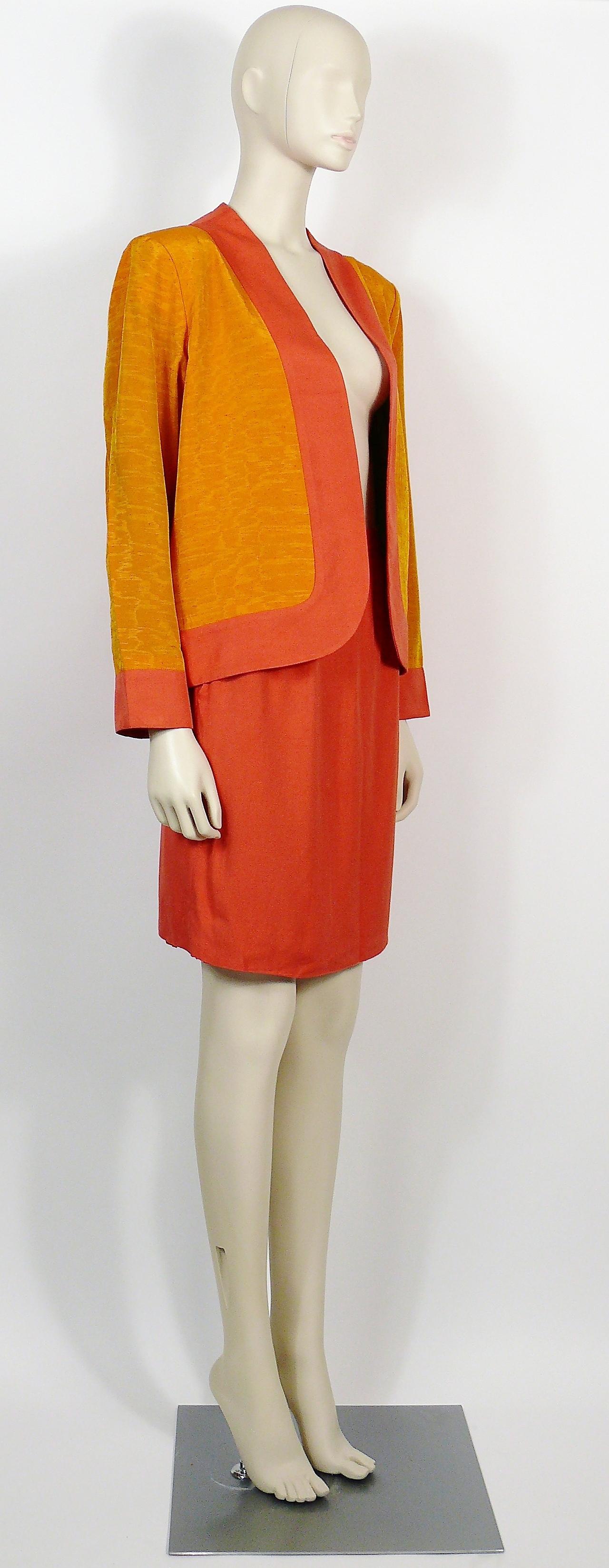 YVES SAINT LAURENT vintage oriental inspired jacket and skirt ensemble from the Spring/Summer Ready-to-Wear 1993 Collection.

JACKET features :
- Saffron color with orange trim collar and cuff.
- Long sleeves.
- Without buttons.
- Blue silk