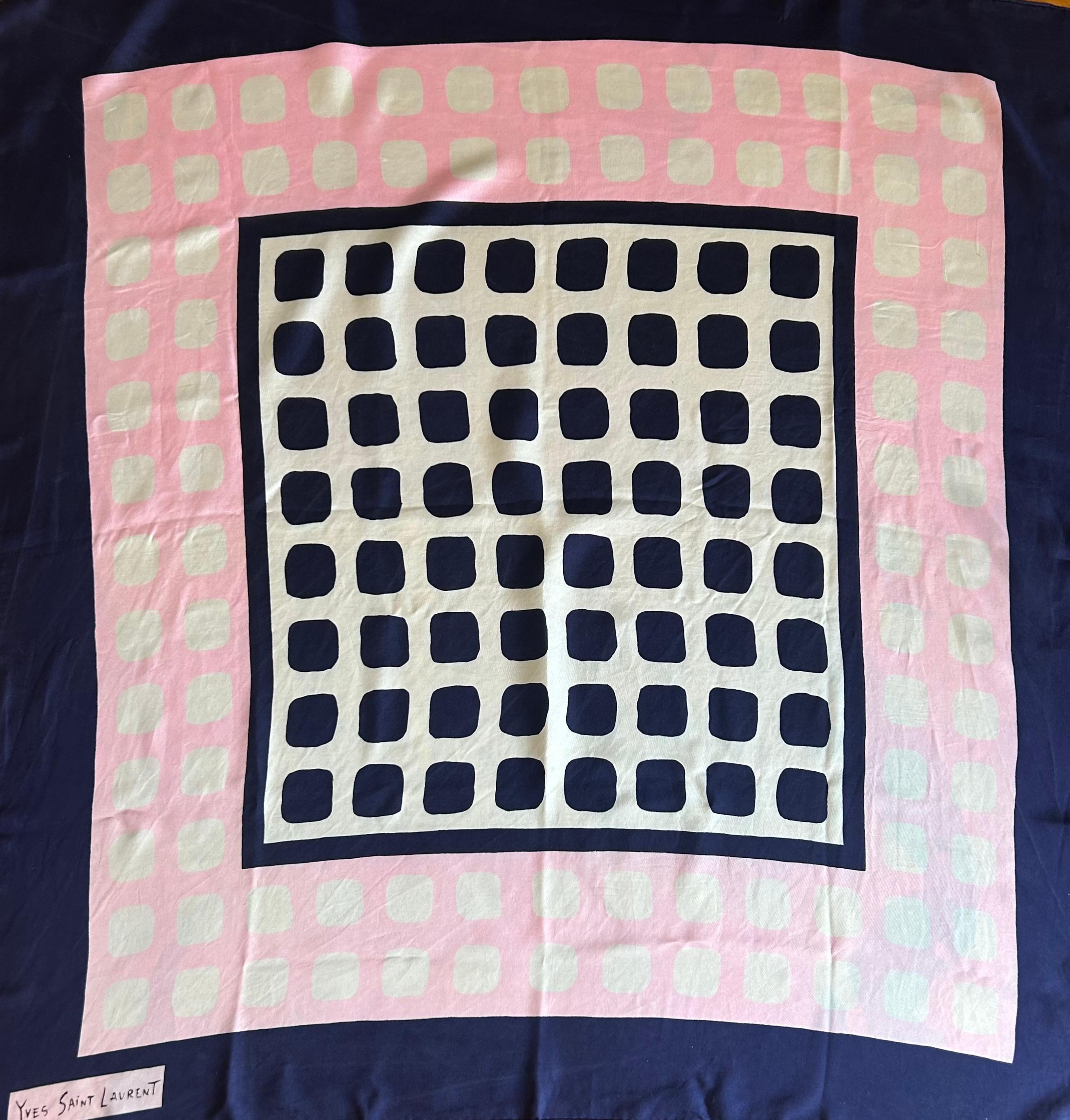 This beautiful Yves Saint Laurent silk scarf is perfect to elevate any of your outfit , the colors are bold, vibrant and perfect for any day.  The YSL marking are small, deliquate yet a perfect statement of the brand. Can be worn as a scarf, top,