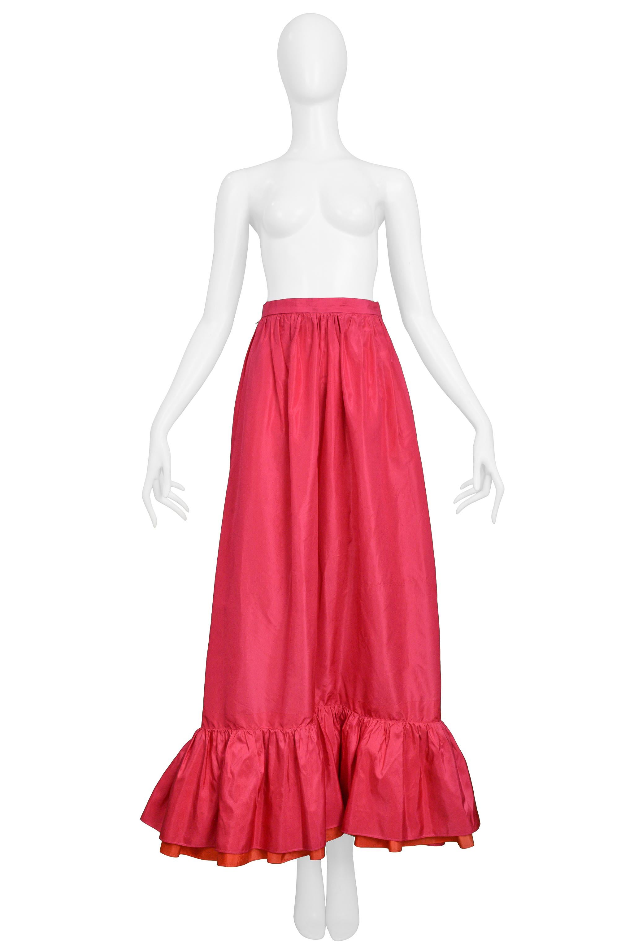 Resurrection Vintage is excited to offer a vintage Yves Saint Laurent silk taffeta maxi skirt featuring a high wasitband, gathered skirt, and pink and red-orange ruffle hem.

Yves Saint Laurent
Size 40
Silk
Good Vintage Condition
Authenticity