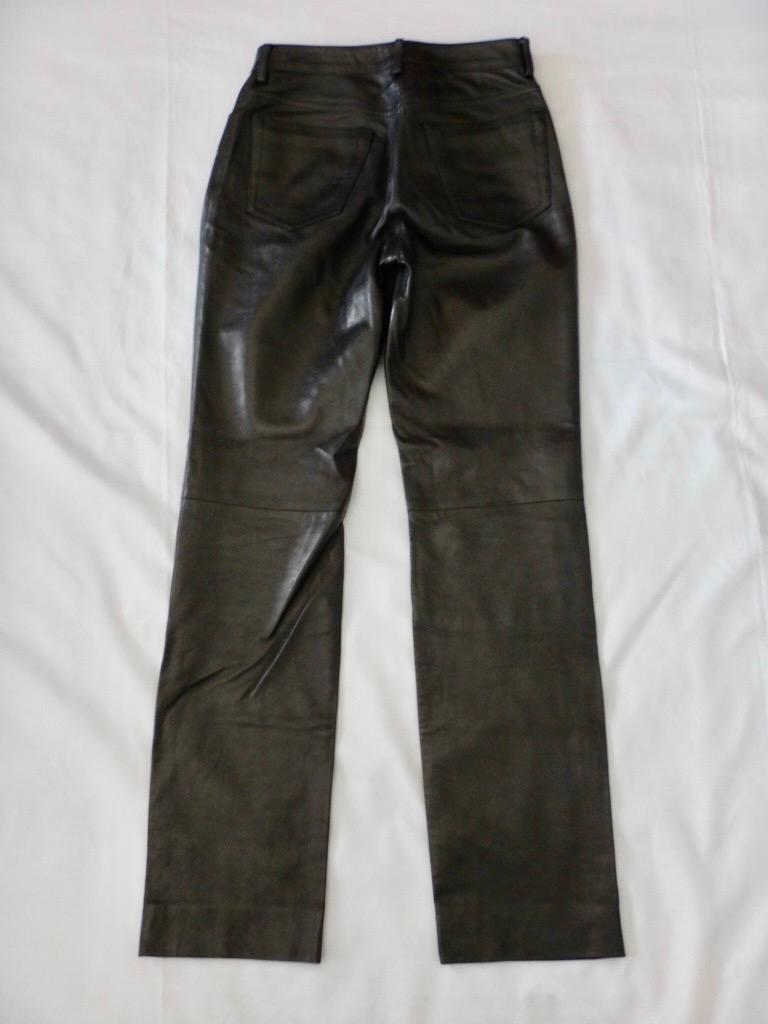 Luxurious black leather button fly pants from YSL Rive Gauche, made in Italy. Jean-style, with two front pockets and a coin pocket and two rear pockets and belt loops. Straight leg. Inside lining from the waist to the knees.

Tagged a size 36.