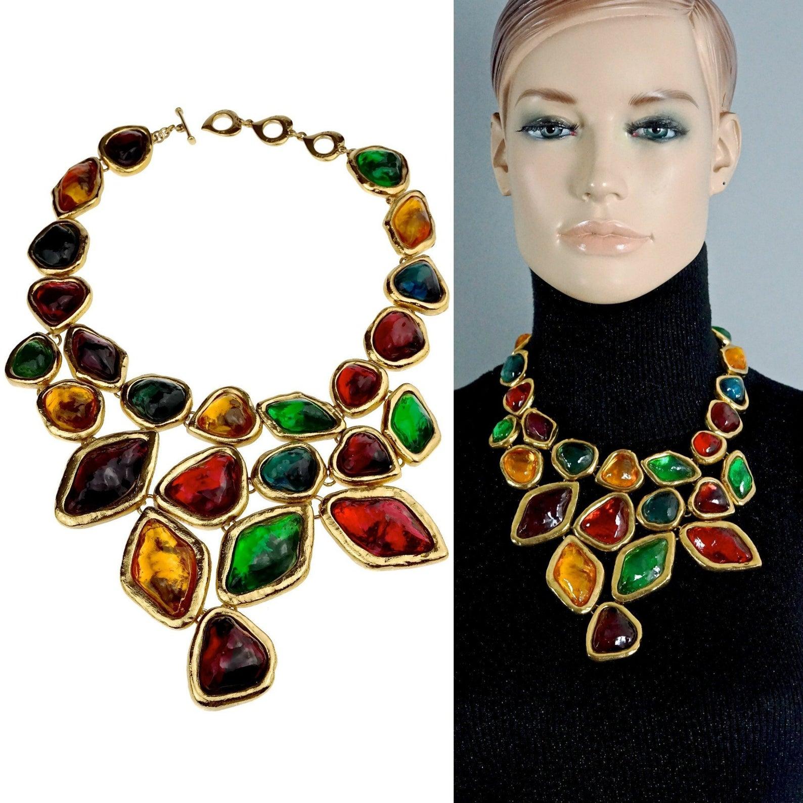 Features:
- 100% Authentic YVES SAINT LAURENT by Robert Goossens.
- Vibrant multi colour poured resin stones and cabochons set on gold tone metal.
- Glass stones are in shapes of Oval, Square, Pear, Round, Marquise with huge Octagon center piece!
-
