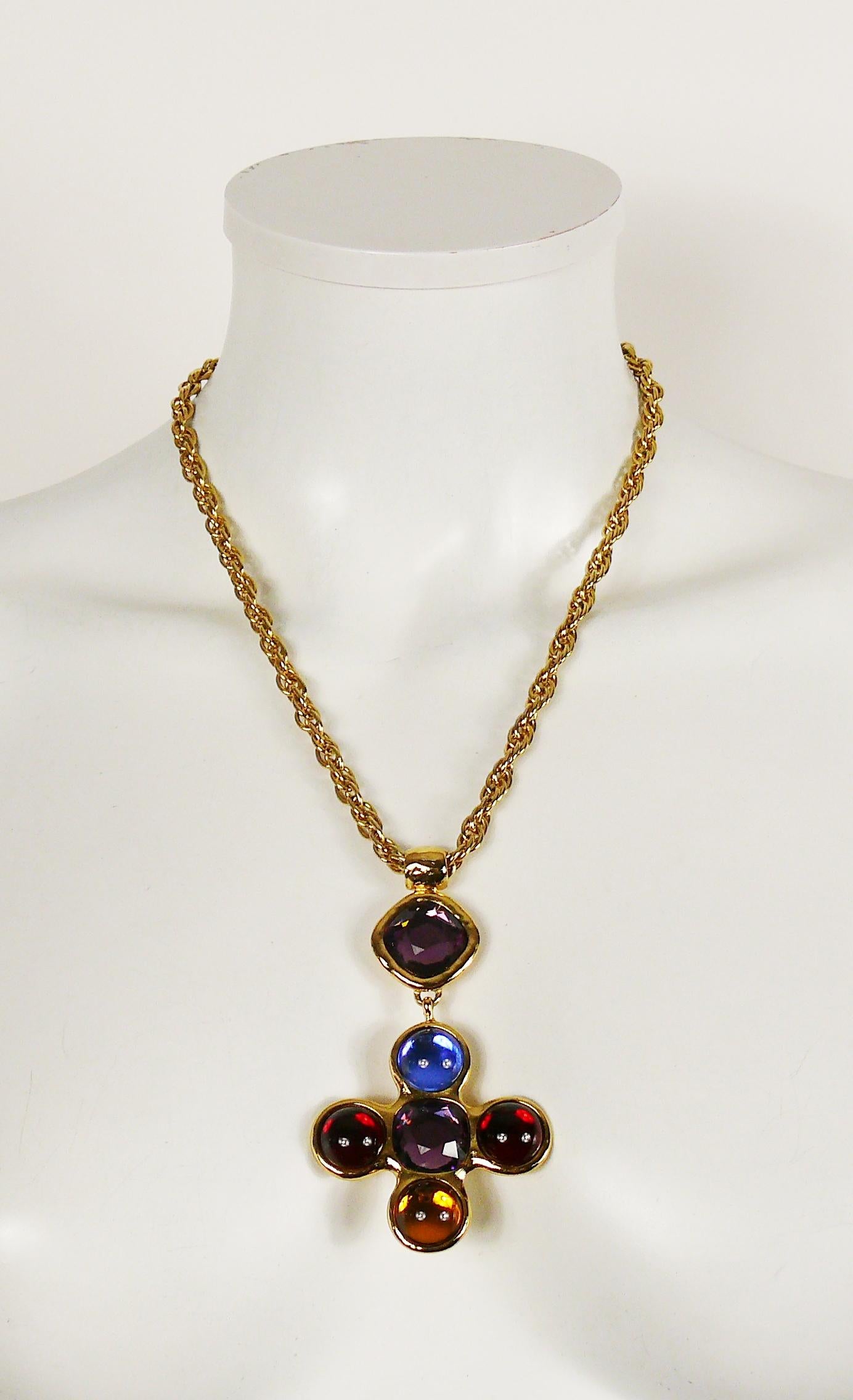 YVES SAINT LAURENT vintage gold toned chain necklace featuring a cross pendant embellished with purple crystals and multicolored glass stones.

Lobster clasp closure.
Extension chain.

Embossed YSL.
Made in France.

Indicative measurements :