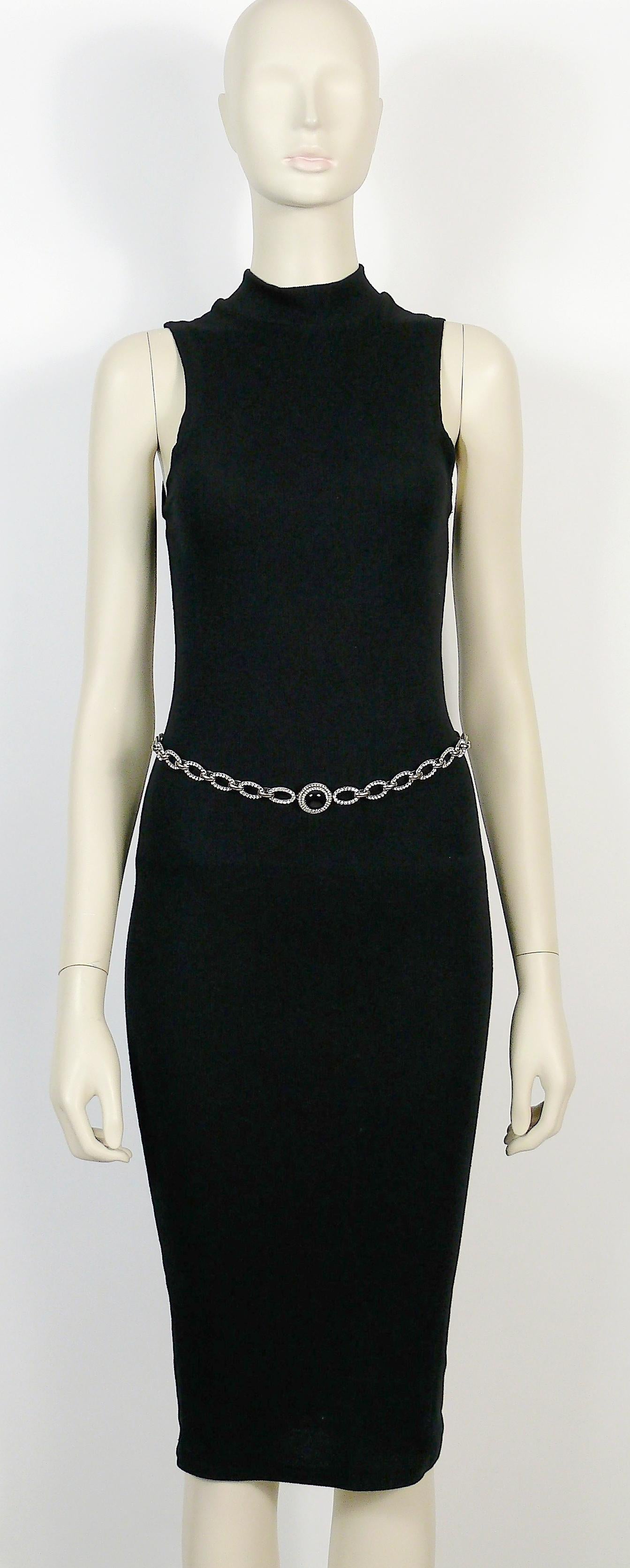 YVES SAINT LAURENT vintage 1970 silver toned chain belt featuring oval links embellished with clear crystals and a black glass cabochon.

Similar model in the collections of the METROPOLITAN MUSEUM OF ART in NEW YORK.

Embossed YSL on the reverse of