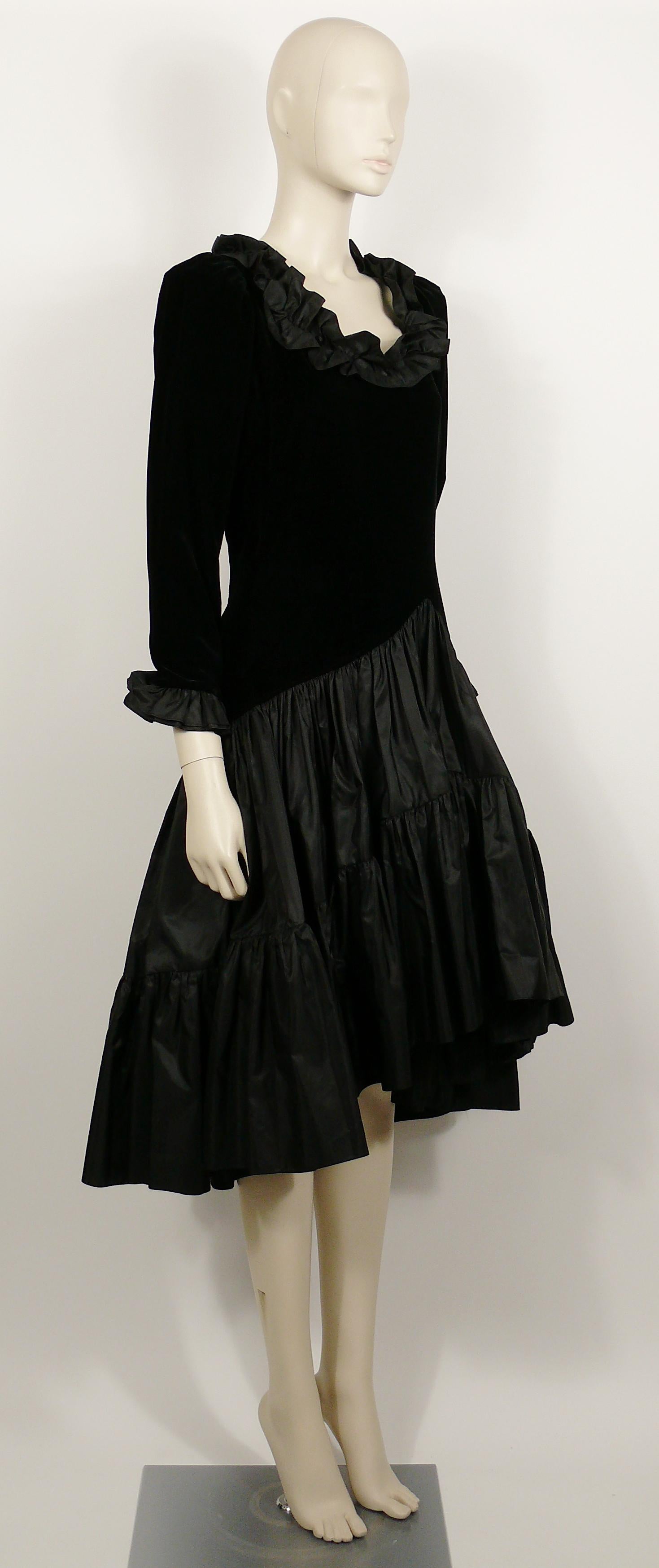YVES SAINT LAURENT Rive Gauche vintage black velvet high low skirt cocktail dress featuring double layered black satin ruffles around the neckline and wrists.

The left side fastens with a hidden zipper.
Fully lined.

Label reads SAINT LAURENT Rive