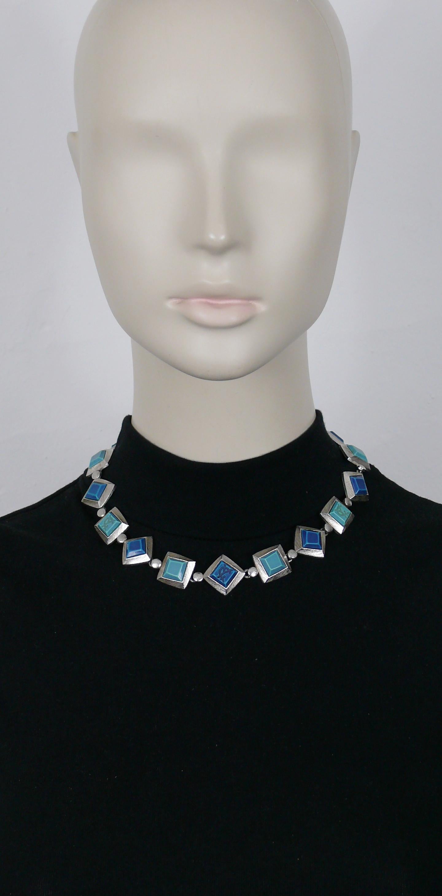 YVES SAINT LAURENT vintage textured silver tone square link necklace embellished with blue shade resin cabochons, some embossed with the YSL logo.

Adjustable T bar and toggle closure.

Embossed YSL Made in France.

Indicative measurements :