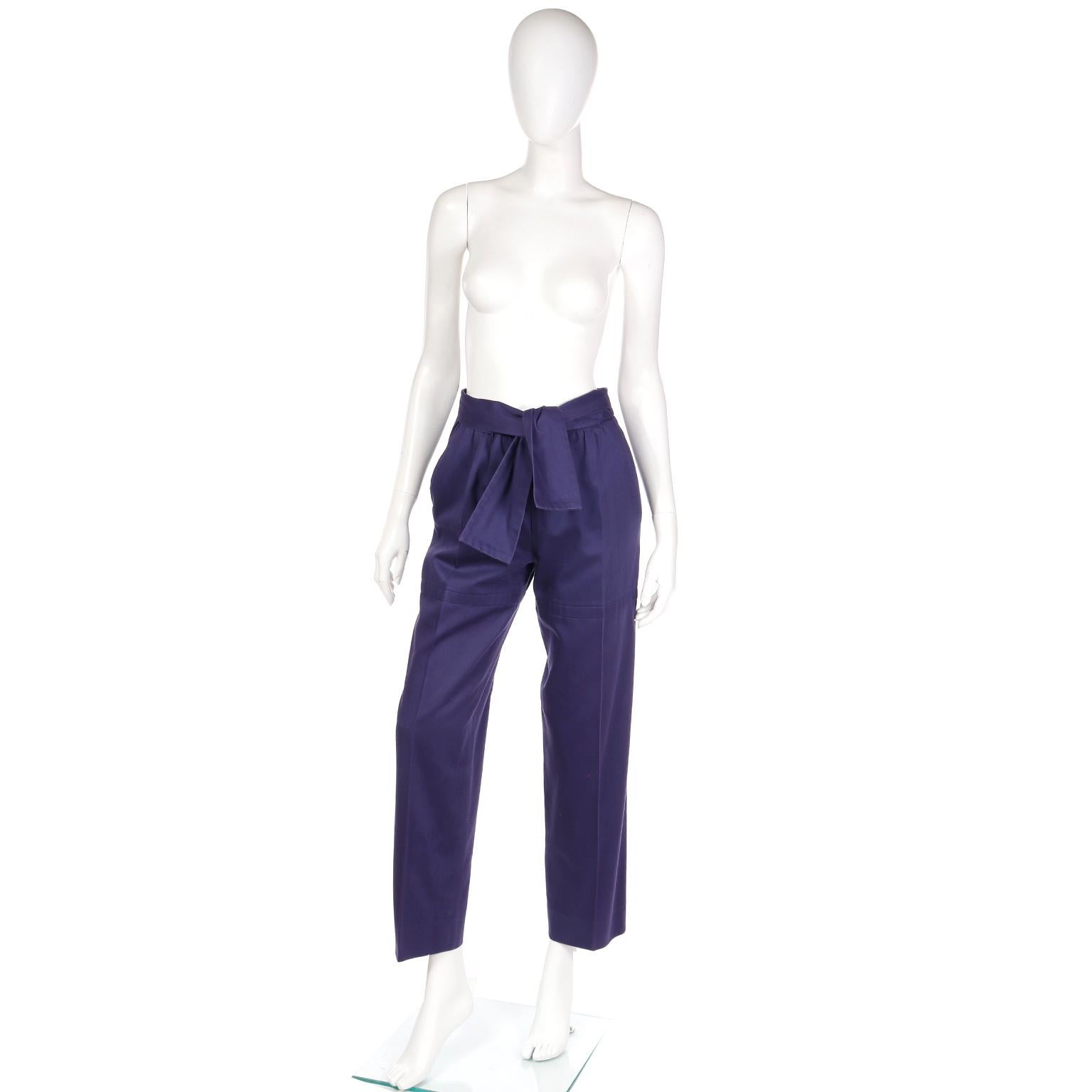 These vintage Yves Saint Laurent purple cotton trousers are anything but ordinary! The color is the perfect rich, jewel tone saturated purple and we fell in love the with attached sash belt that can be tied in numerous ways.
These pants have a
