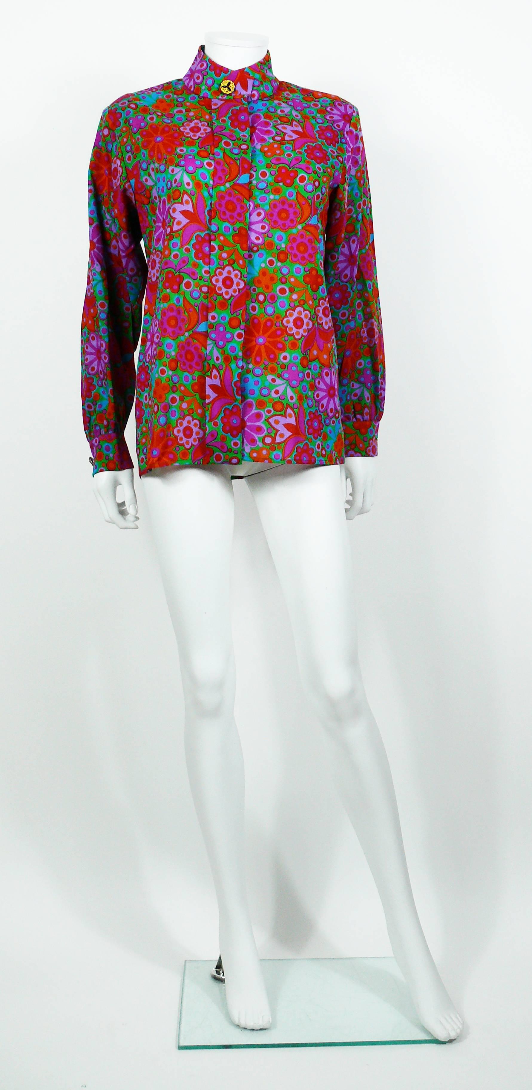 YVES SAINT LAURENT vintage floral print shirt in vibrant colors.

This shirt features :
- Mandarin collar.
- Long sleeves.
- Jewelled gold toned buttons on collar and cuffs.
- Hidden front buttoning.
- Thin shoulder pads.

Label reads YVES SAINT