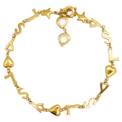 Yves Saint Laurent YSL Vintage Oro Cuore Stella Classic Logo Charms Collana lunga