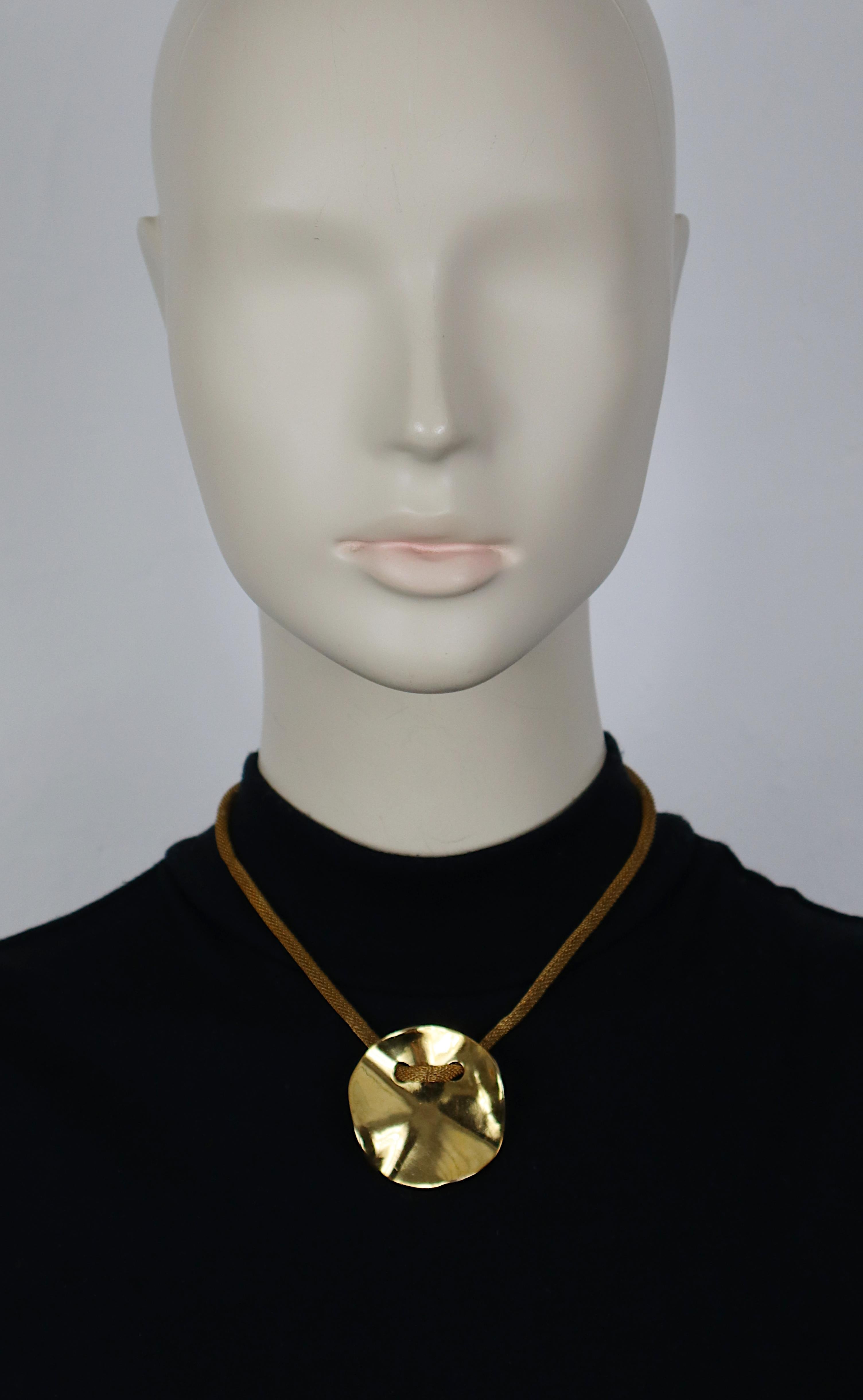 YVES SAINT LAURENT vintage gold tone mesh chain necklace featuring a creased disc medallion.

Adjustable heart toggle clasps.

Embossed YSL Made in France.
Cursive YVES SAINT LAURENT signature embossed on the heart toggles.

Indicative measurements