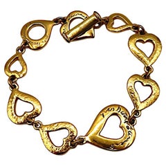 YVES SAINT LAURENT YSL Bracciale d'epoca con cuore in tono dorato
