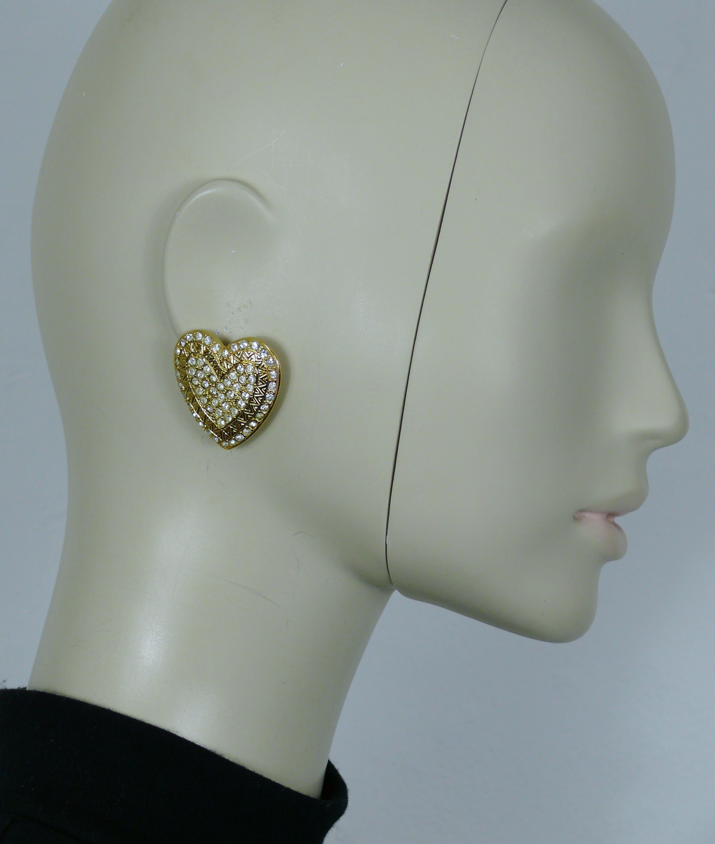 YVES SAINT LAURENT vintage gold tone heart clip-on earrings embellished with clear crystals.

Embossed YSL Made in France.

Indicative measurements : max. height approx. 3.4 cm (1.34 inches) / max. width approx. 3.2 cm (1.26 inches).

Weight per