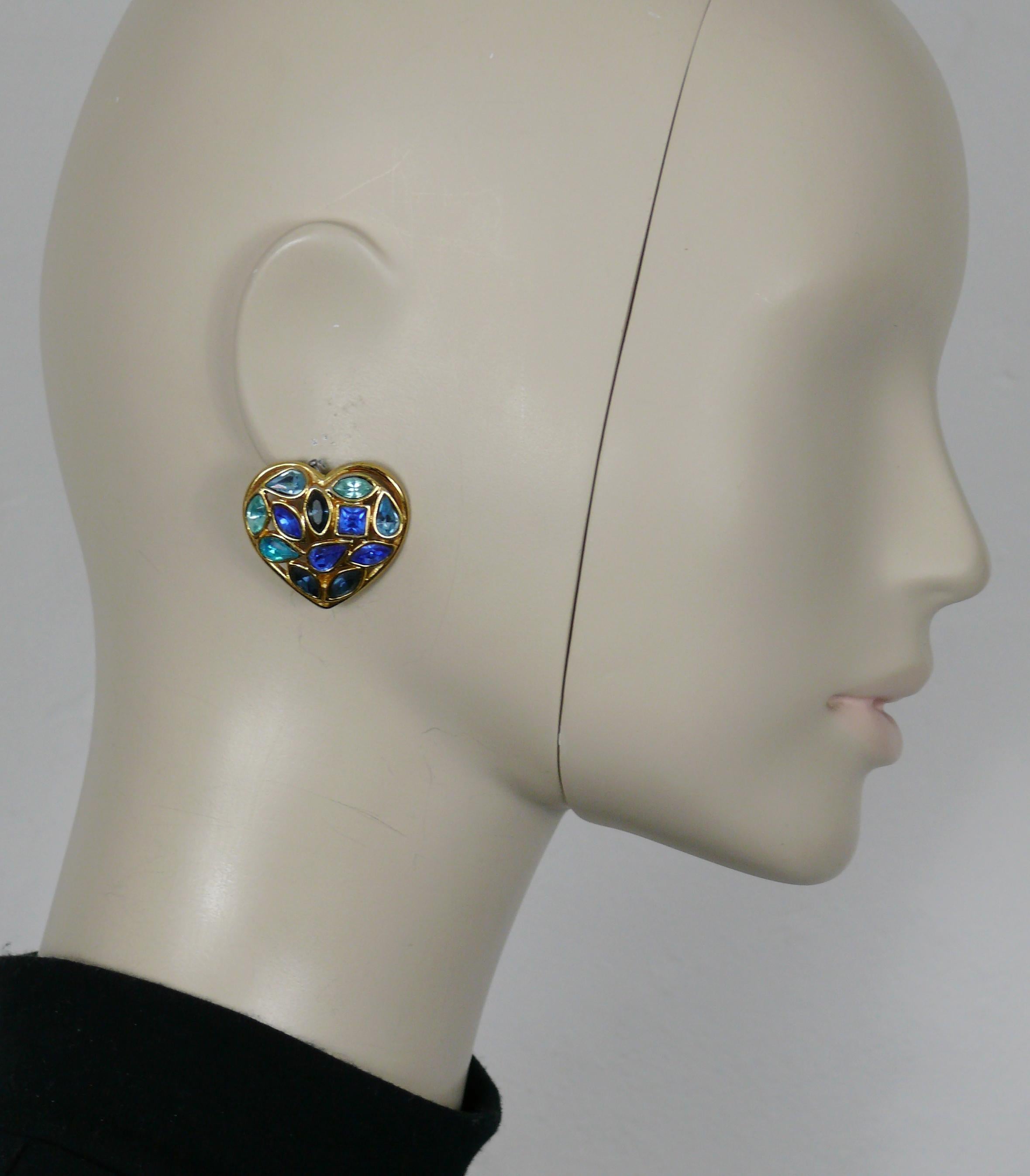 YVES SAINT LAURENT vintage gold tone heart clip-on earrings embellished with blue shade crystals.

Embossed YSL Made in France.

Indicative measurements : max. height approx. 2.9 cm (1.14 inches) / max. width approx. 3.2 cm (1.26 inches).

Weight