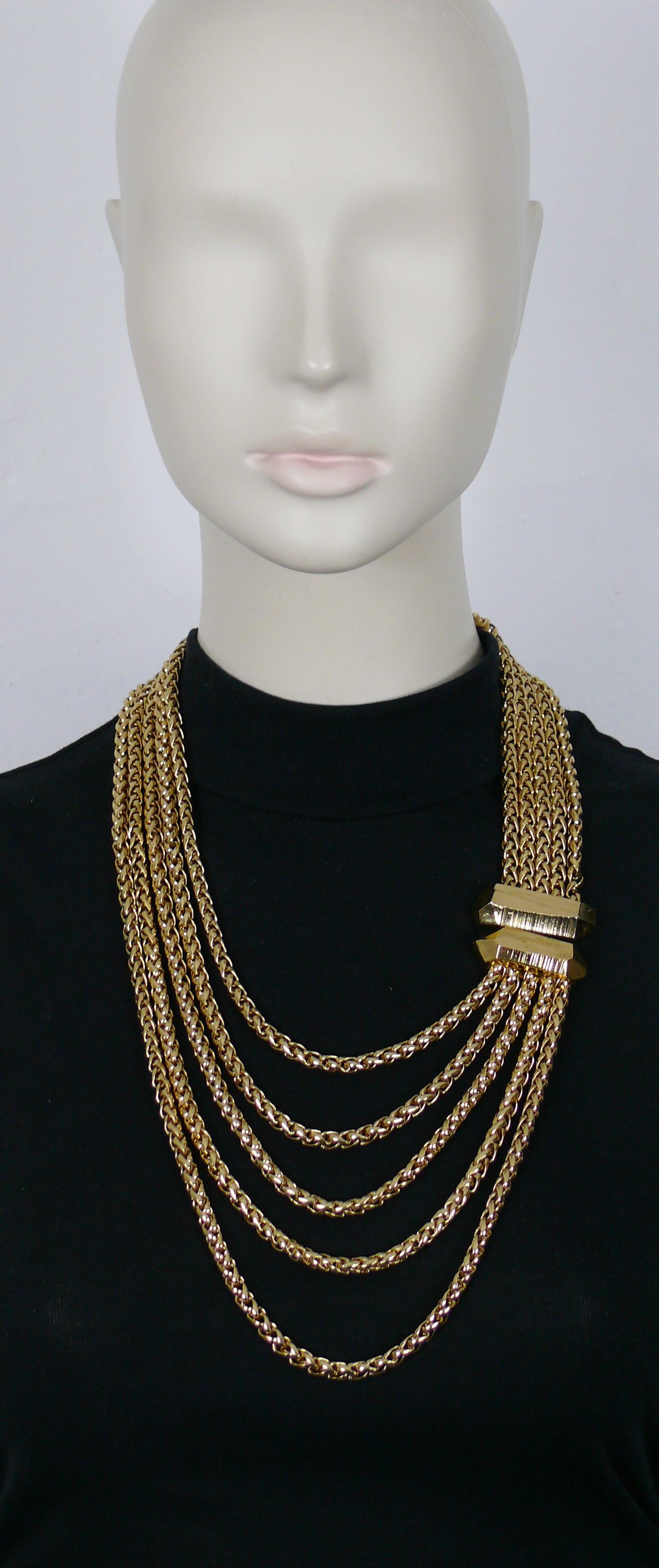 YVES SAINT LAURENT by ROBERT GOOSSENS vintage gold tone multi-strand chain necklace featuring a rock-crystal shape design clasp.

Hook clasp closure.

Embossed YSL Made in France.

Indicative measurements : length approx. 54 cm (21.26