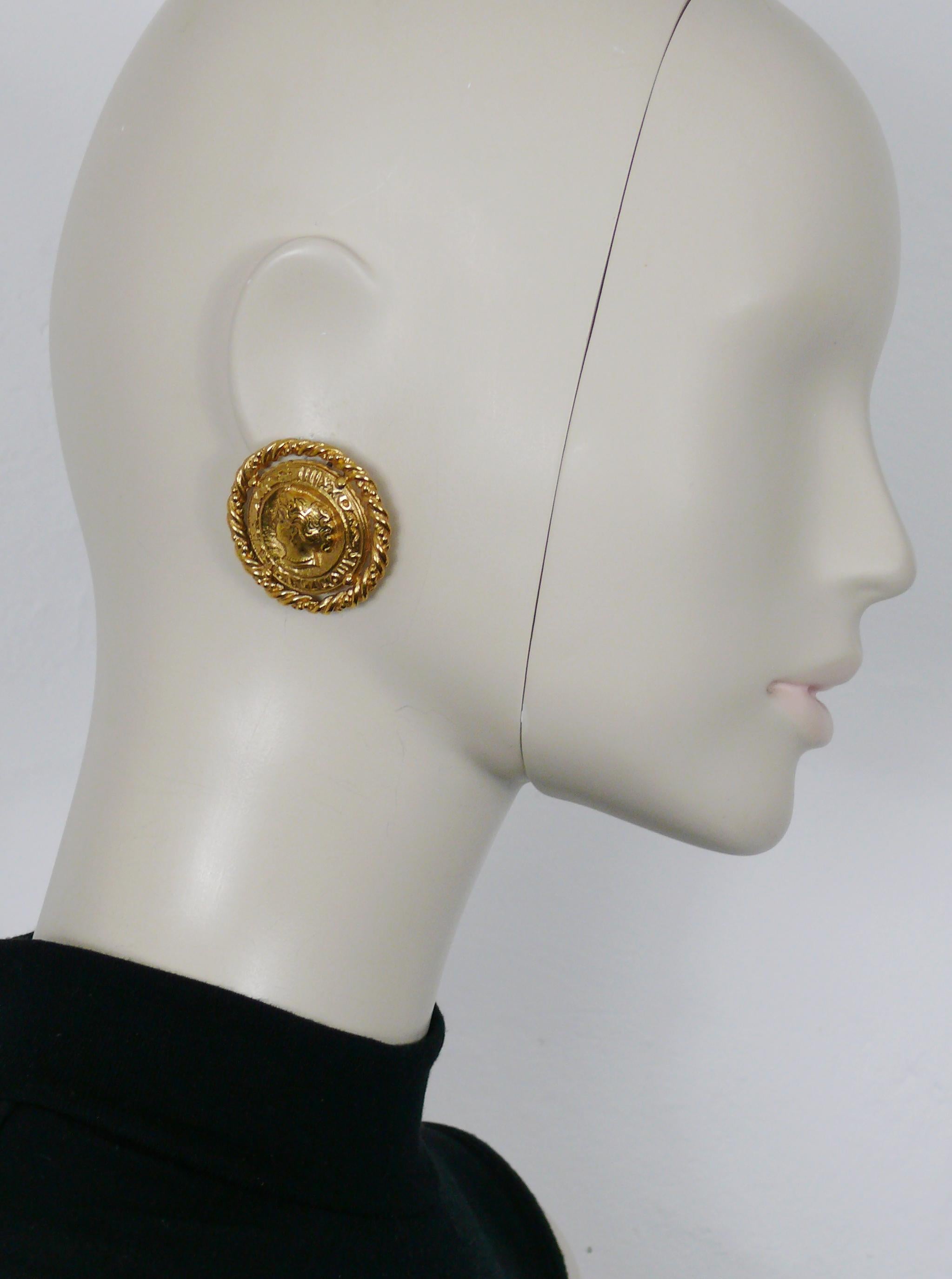 YVES SAINT LAURENT vintage raised gold toned lady profile coin clip-on earrings set in a torsade patterned rim.

Embossed YSL Made in France.

Indicative measurements : diameter approx. 3.8 cm (1.50 inches).

Weight per earring : approx. 18