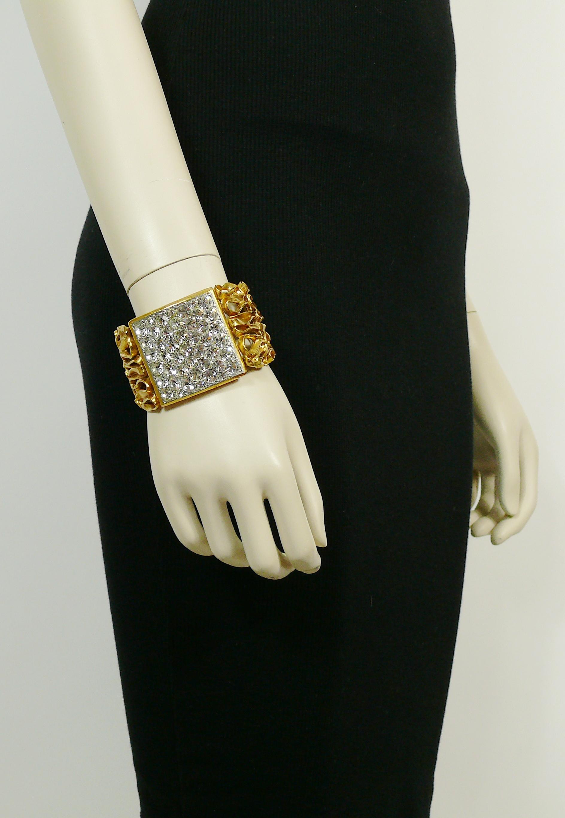 YVES SAINT LAURENT vintage rare gold toned cuff bracelet featuring a coiled wire pattern and a large square section embellished with clear crystals.

Embossed YVES SAINT LAURENT RIVE GAUCHE Made in France.

Indicative measurements : inner