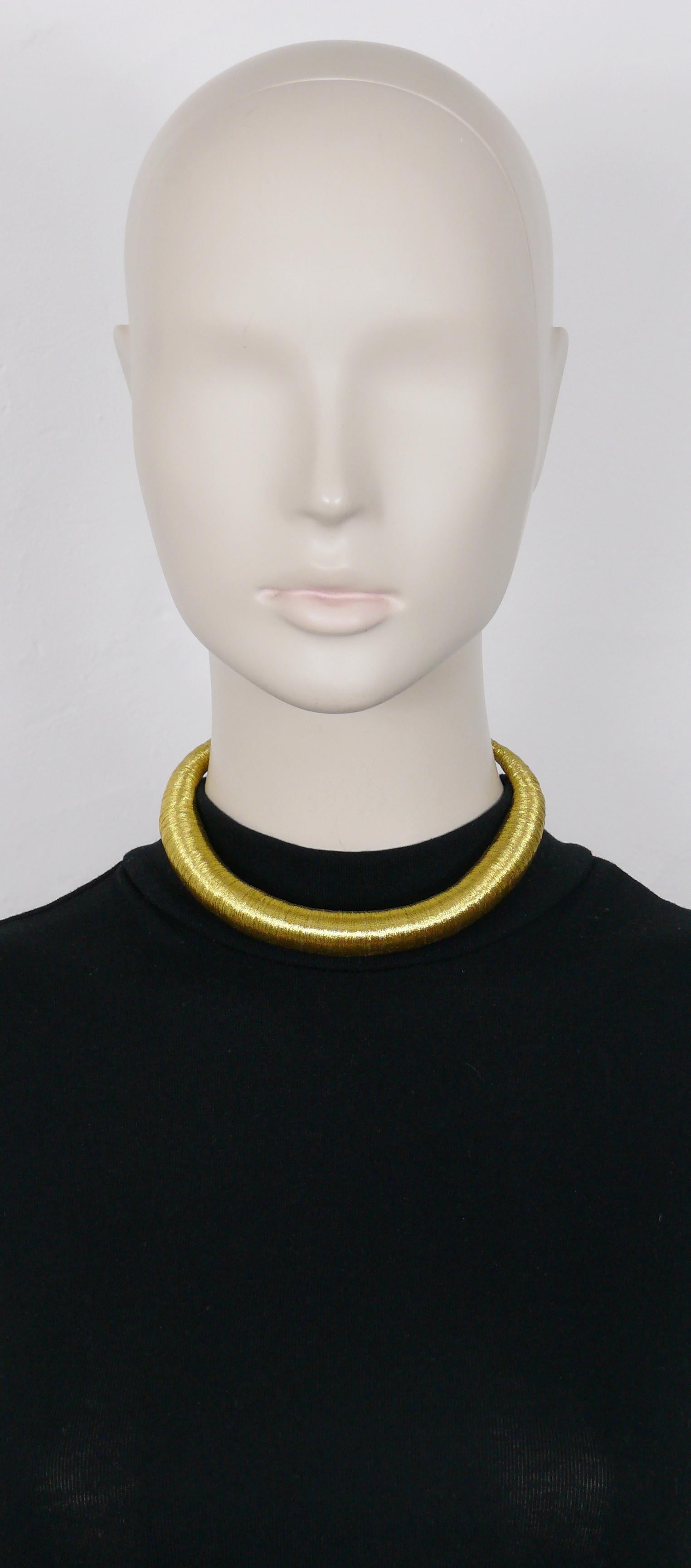YVES SAINT LAURENT vintage lightweight torque necklace. made of braided gold toned threads.

Ball and toggle closure.

Embossed YSL on a metal hanging tag.

Indicative measurements : inner circumference (unstretched) approx. 32.99 cm (12.99 inches)