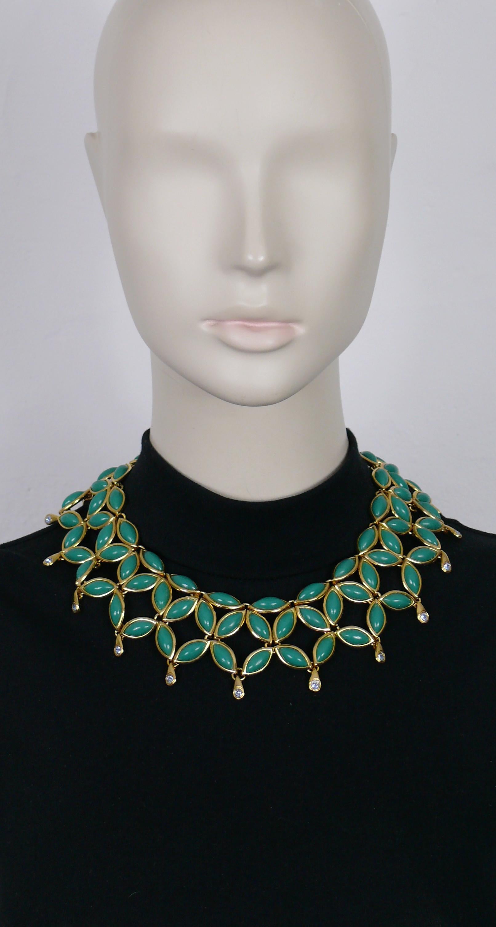 YVES SAINT LAURENT vintage gold tone collar necklace featuring green resin cabochons and acqua blue crystals.

Spring clasp closure.
Adjustable length.

Embossed YSL Made in France.

Indicative measurements : adjustable length from approx. 37 cm