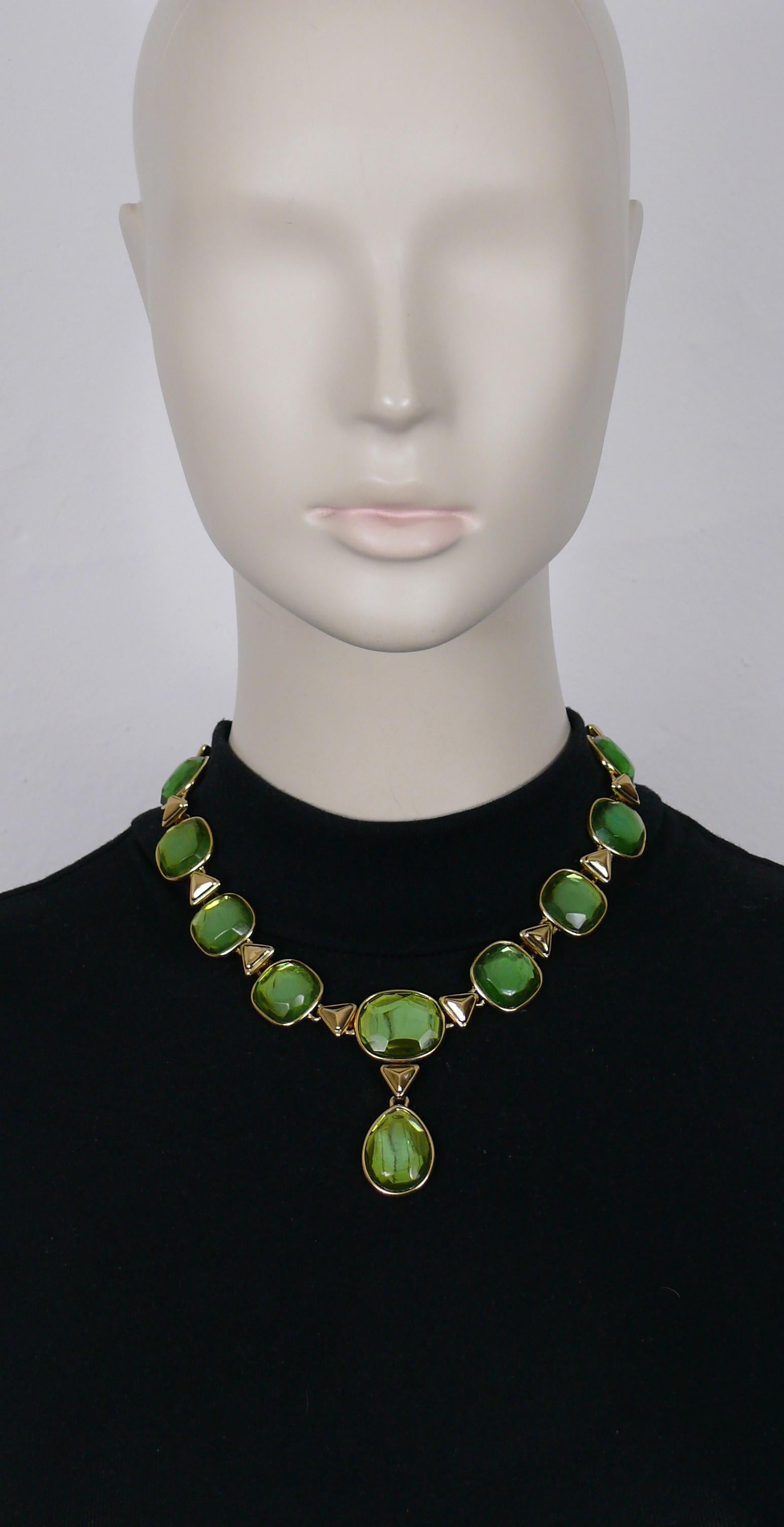 YVES SAINT LAURENT vintage gold tone necklace featuring green resin cabochons.

Spring clasp closure.
Adjustable length.

Embossed YSL Made in France.

Indicative measurements : adjustable length from approx. 40 cm (15.75 inches) to approx. 45 cm