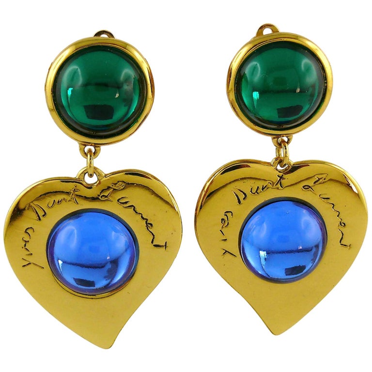 earrings. woman blue jacket cabochon glass