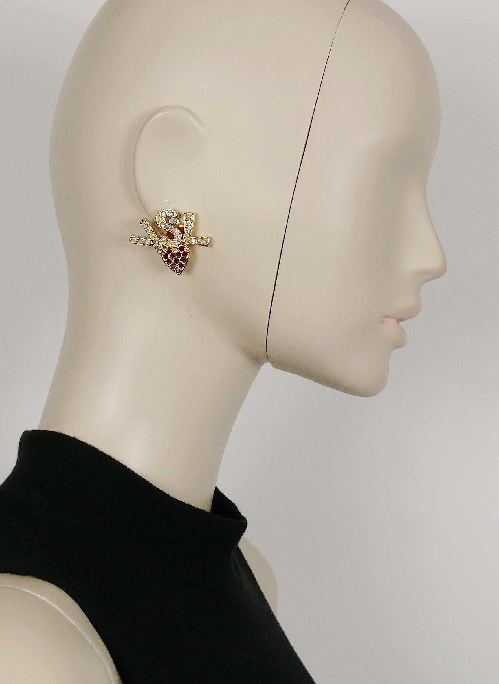 YVES SAINT LAURENT vintage iconic gold toned initials heart clip-on earrings embellished with clear and ruby crystals.

Embossed YSL Made in France.

Indicative measurements : height approx. 3 cm (1.18 inches) / max. width approx. 3.5 cm (1.38