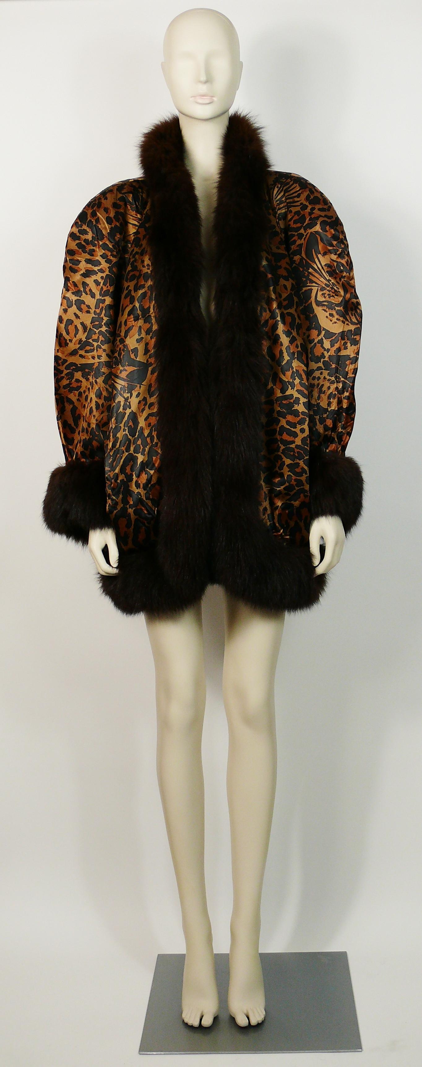 YVES SAINT LAURENT vintage iconic leopard print coat.

This coat features :
- Iconic YVES SAINT LAURENT leopard print exterior with hidden leopard faces.
- Brown fur trim.
- Exagerated padded shoulders.
- No closure.
- Two pockets.
- Black quilted