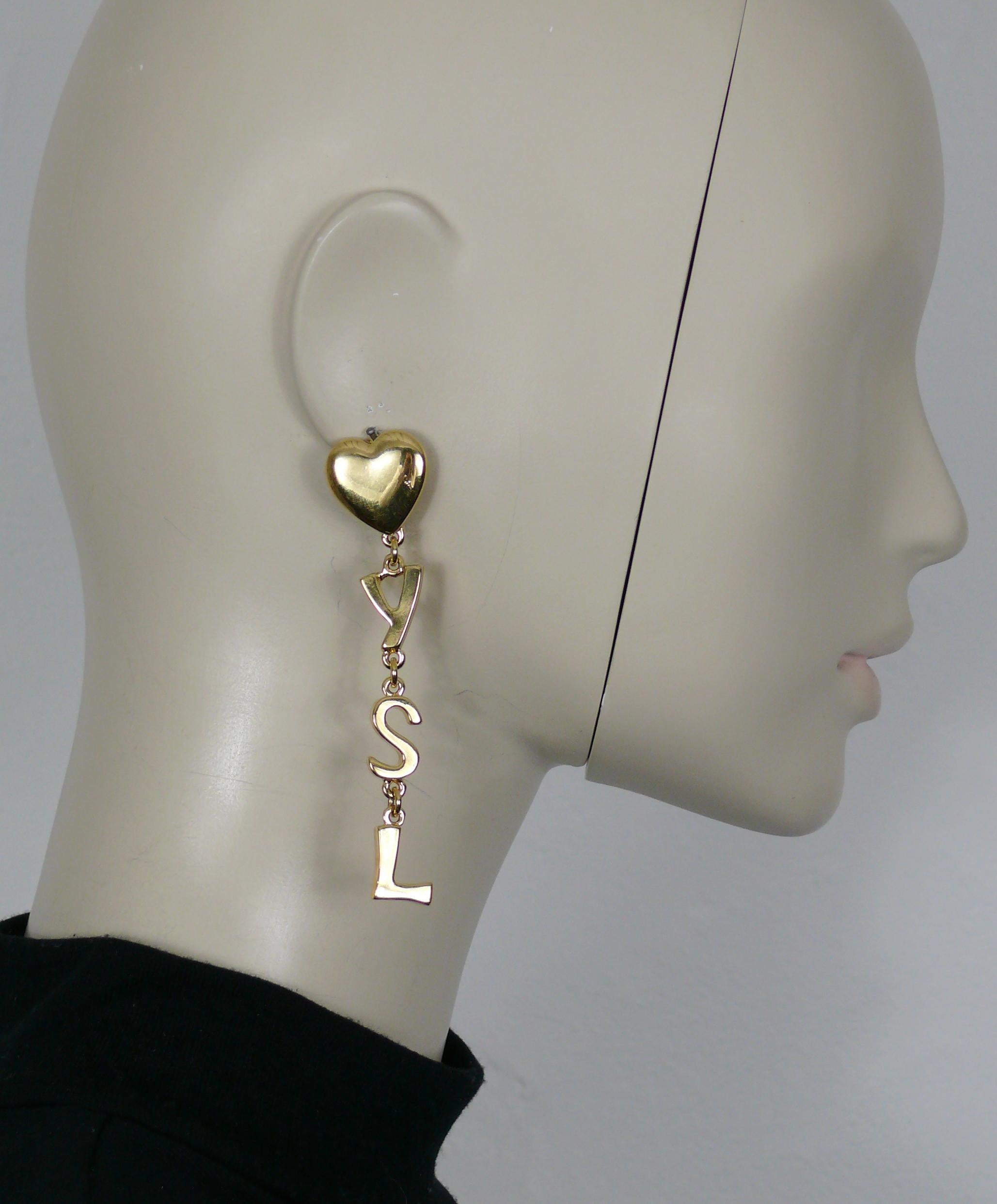 YVES SAINT LAURENT vintage iconic gold toned initials dangling earrings (clip-on).

Marked YSL Made in France.

Indicative measurements : height approx. 9 cm (3.54 inches) / max. width approx. 2 cm (0.79 inch).

Weight per earring : approx. 14