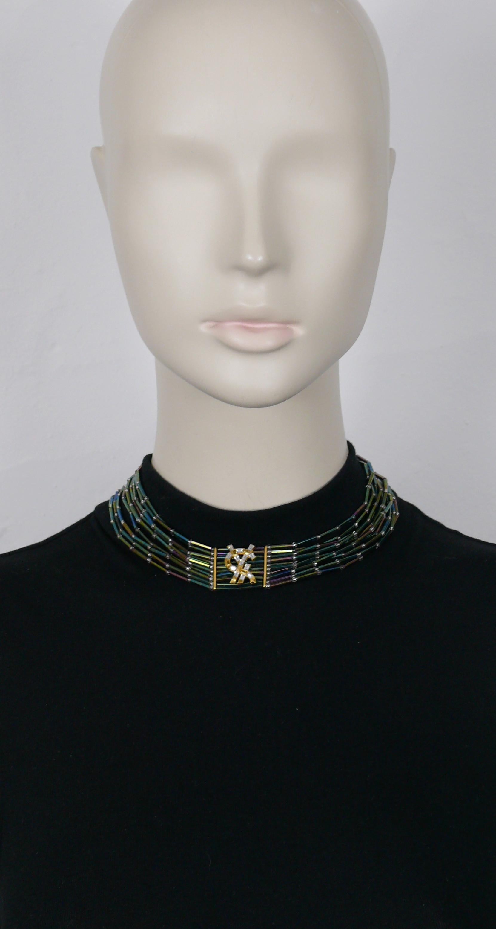YVES SAINT LAURENT vintage choker necklace featuring iridescent glass tube beads and a YSL logo embellished with crystals at the center.

T-bar and toggles closure.
Adjustable length.

Embossed YSL on the toggles.

Indicative measurements :