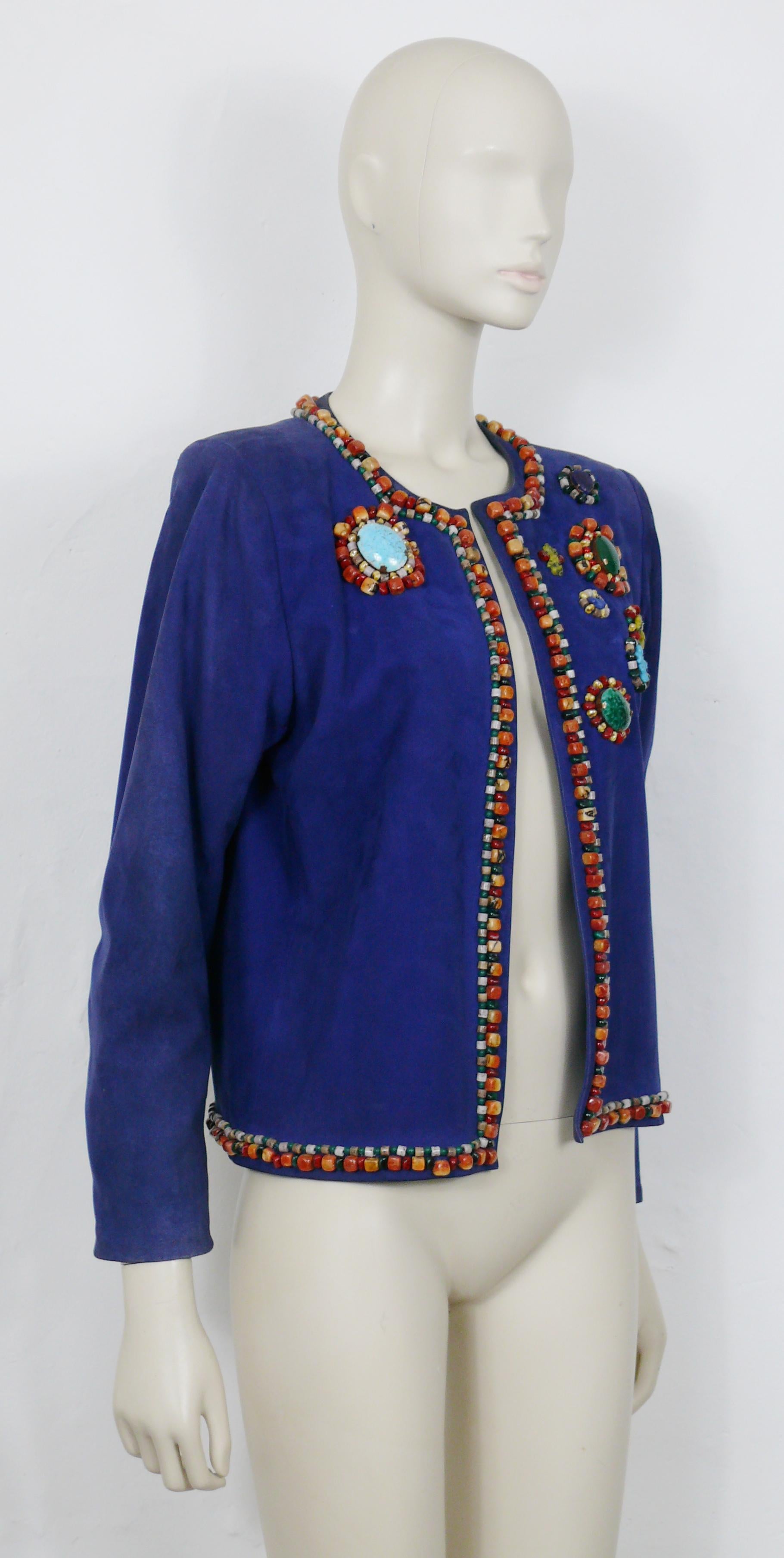 YVES SAINT LAURENT vintage blue lambskin jacket beautifully embellished with multicolored glass cabochons and resin beads.

This jacket features :
- Blue color lambskin.
- Embroidered resin beads and multicolored glass cabochons.
- No buttoning.
-