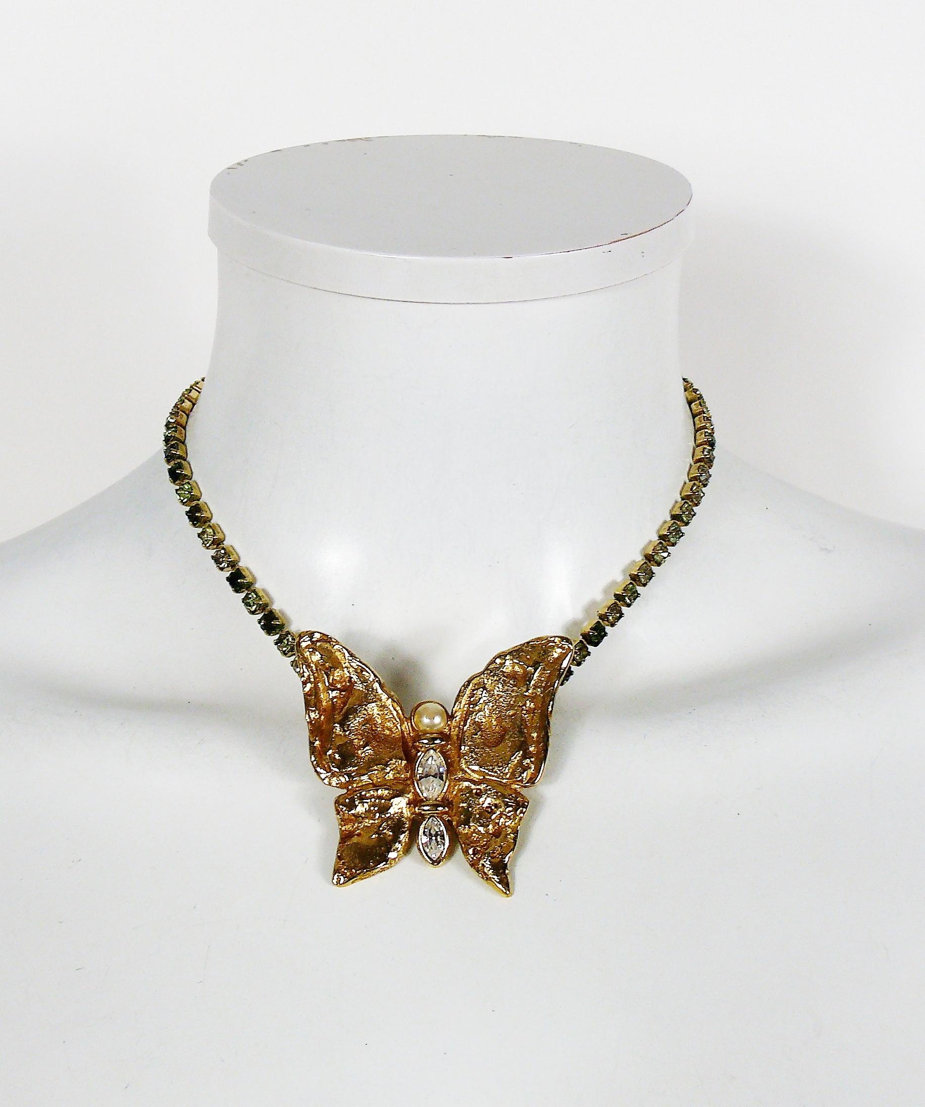 YVES SAINT LAURENT vintage textured gold toned butterfly necklace embellished with crystals and faux pearl.

Embossed YSL Made in France.

Indicative measurements : length approx. 39.5 cm (15.55 inches) / butterfly max. height approx. 4.8 cm (1.89