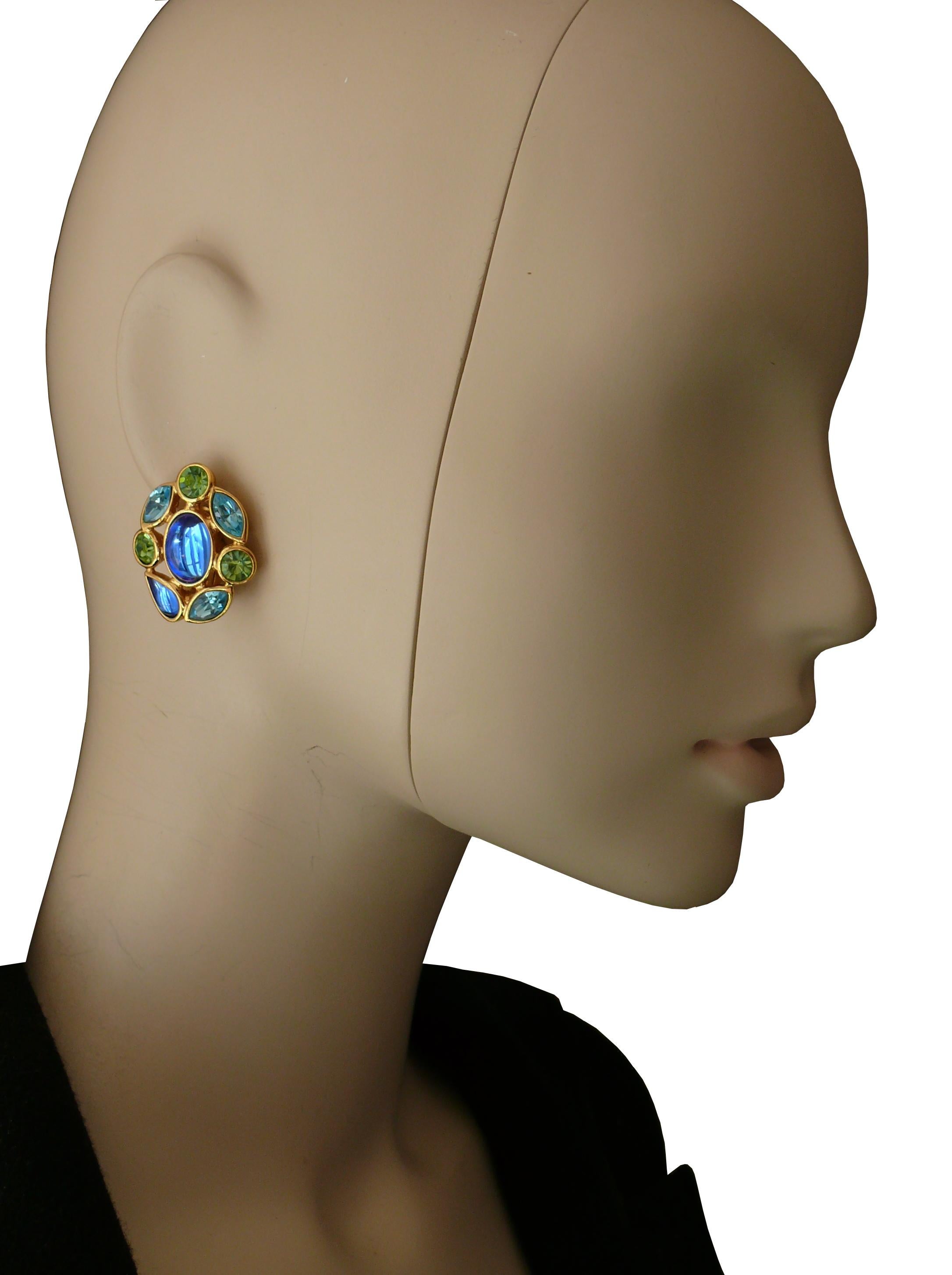 YVES SAINT LAURENT vintage gold toned clip-on earrings featuring a blue glass cabochon center and multicolored crystals.

Embossed YSL Made in France.

Indicative measurements : approx. 3.2 cm (1.26 inches) x 2.6 cm (1.02 inches).

NOTES
- This is a