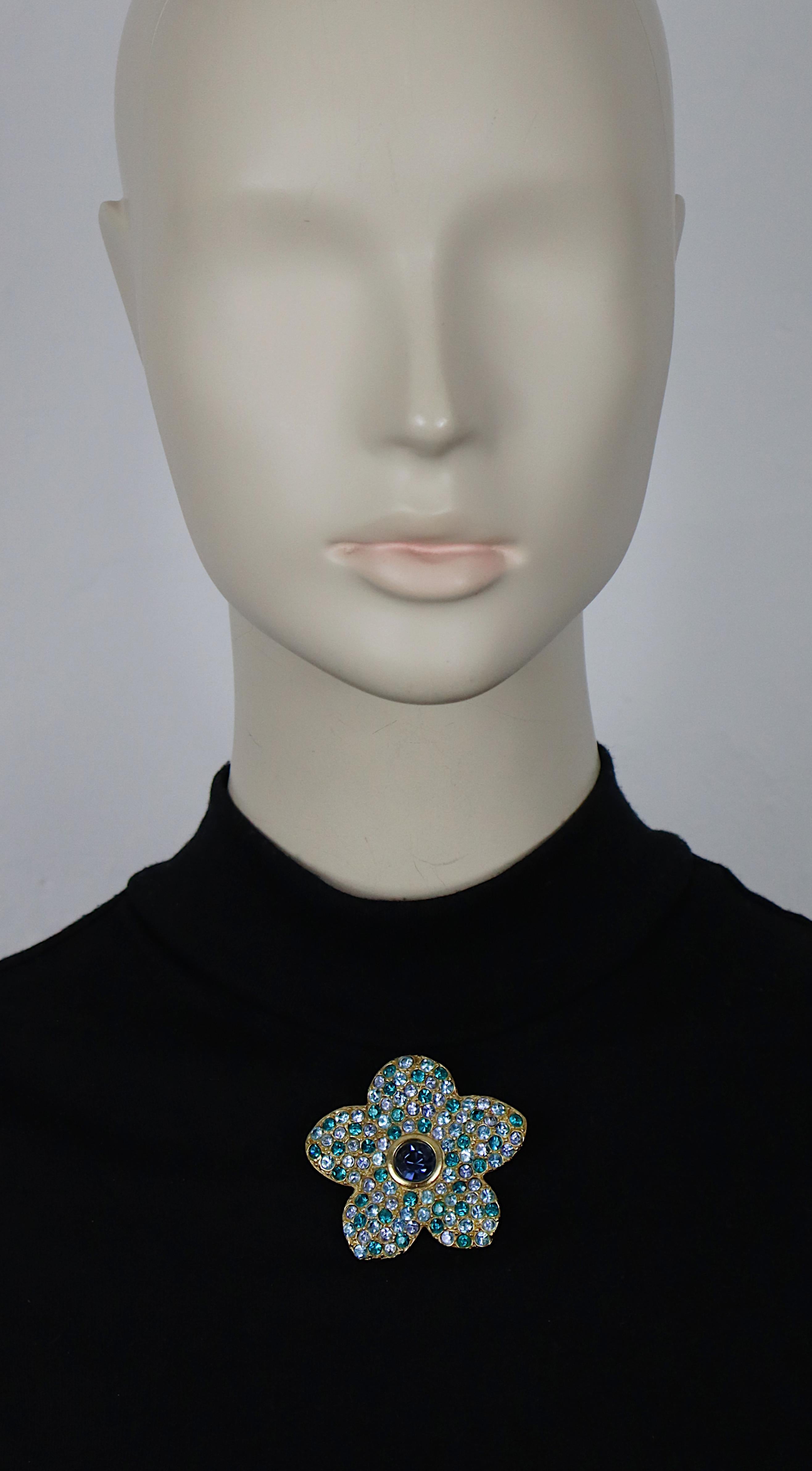 YVES SAINT LAURENT vintage gold tone flower brooch/pendant embellished with multicolor crystals.

Can be worn as a brooch or a pendant.

Embossed YSL Made in France.

Indicative measurements : max. height approx. 5 cm (1.97 inches) / max. width
