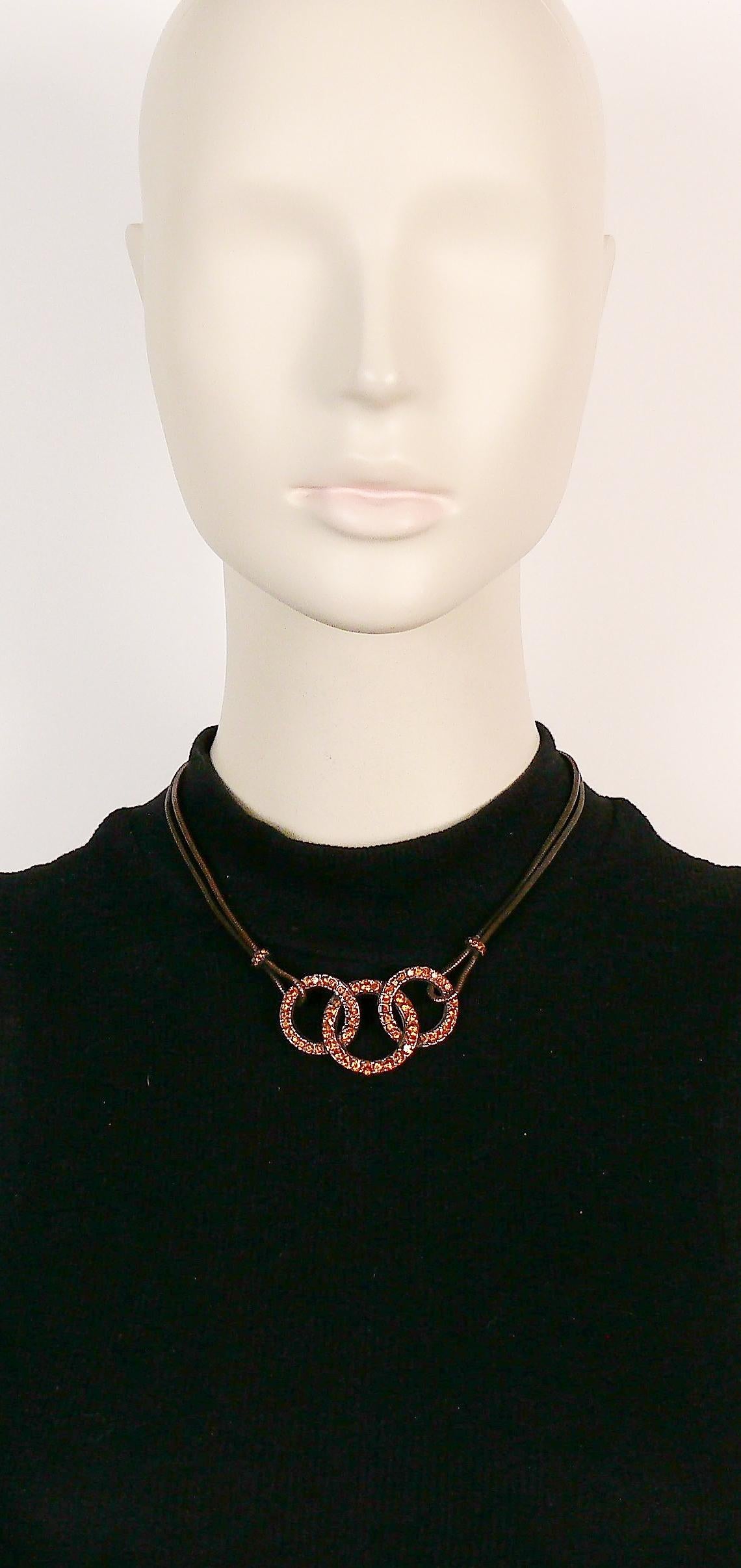 YVES SAINT LAURENT vintage antiqued copper toned necklace featuring a double snake chain and three intertwined rings embellished with citrine color crystals.

Adjustable T-bar and toggle closure.

Embossed YSL Made in France.

Indicative