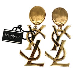 YVES SAINT LAURENT YSL Vintage Massive Gold Tone Iconic Logo Dangling Earrings