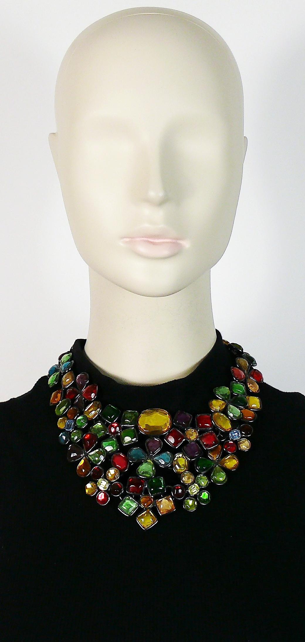 YVES SAINT LAURENT vintage rare opulent bib necklace featuring stylized resin flowers in various sizes and colours embellished with crystals in a gun patina setting.

Adjustable hook closure

Embossed YSL Made in France.

Indicative measurements :