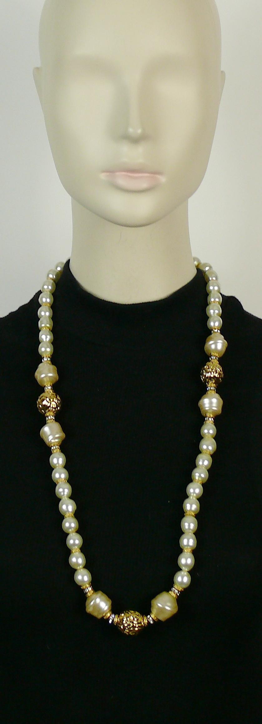 YVES SAINT LAURENT vintage faux necklace featuring irregular shaped faux pearls, gold toned metal beads with arabesques design and clear crystal rondelles.

Lobster clasp closure.

Embossed YSL Made in France.

Indicative measurements : length