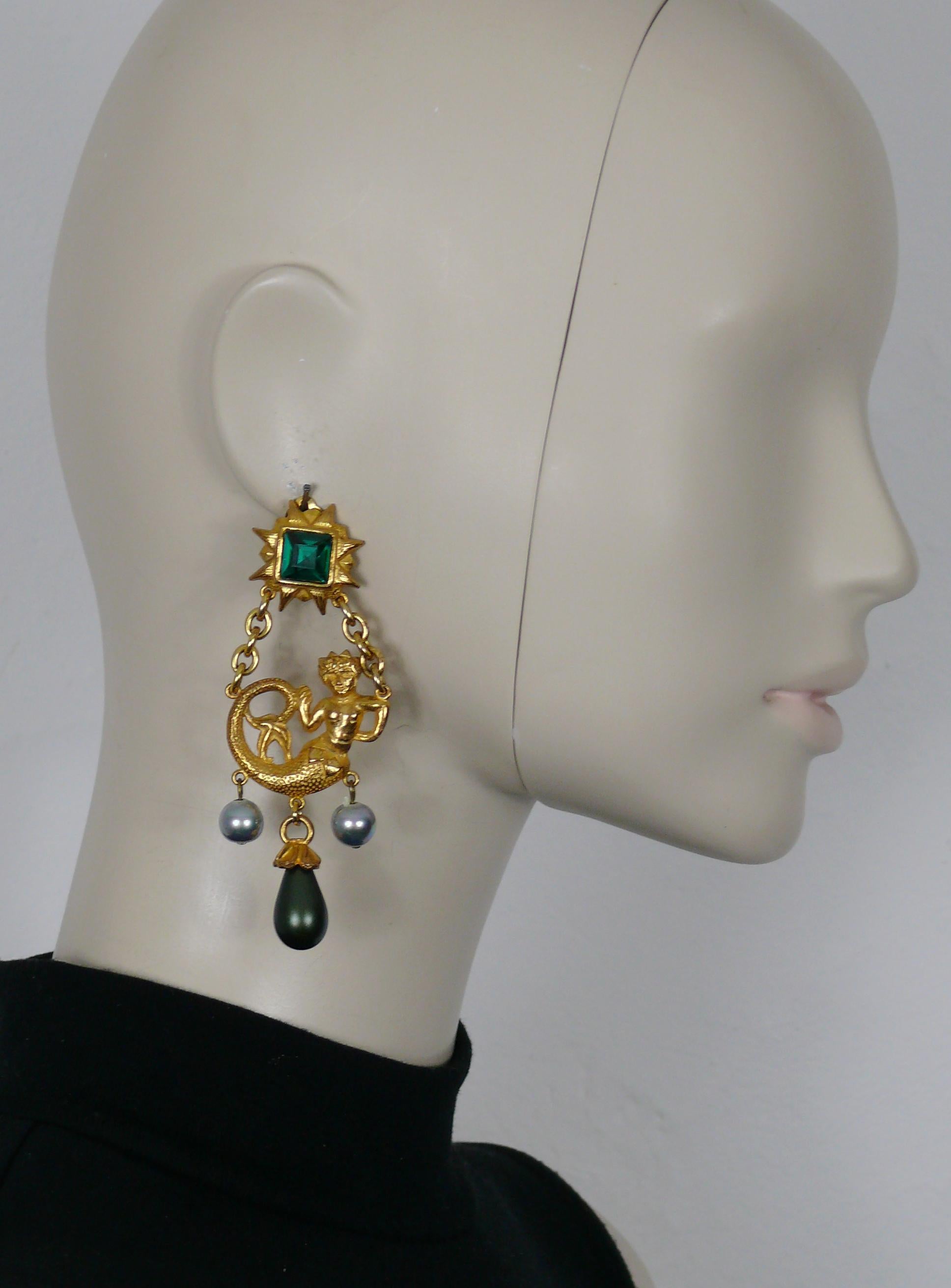YVES SAINT LAURENT vintage rare gold tone dangling earrings (clip on) featuring a mermaid topped by a radiant sun embellished with a large emerald colour crystal, glass faux pearl (iridescent grey) and drop (matte olive green).

Embossed YSL Made in