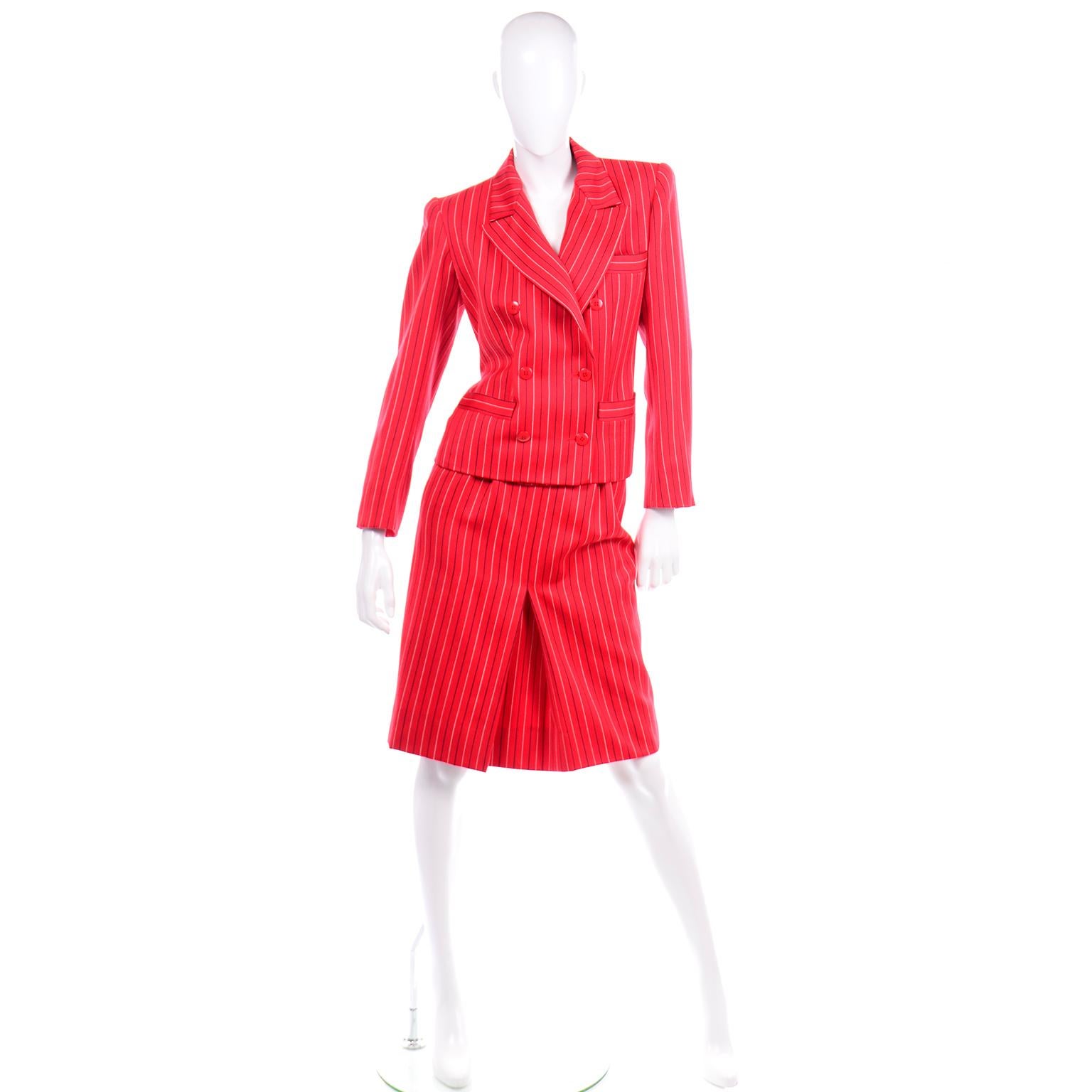 This incredible vintage red 2 piece skirt suit from Yves Saint Laurent is in excellent condition and was most likely never worn!  The lovely red fine wool fabric has Navy and white pinstripes.  The blazer / jacket is double breasted with shoulder