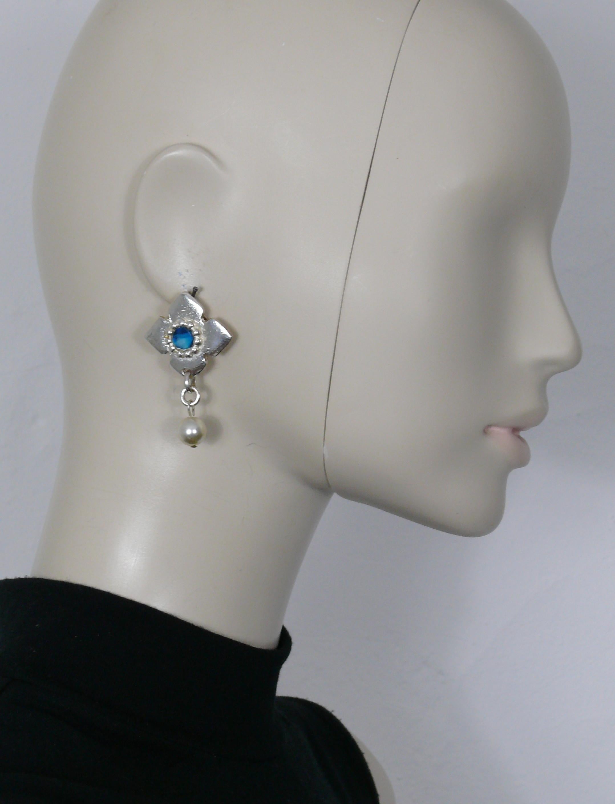 YVES SAINT LAURENT vintage silver tone dangling earrings (clip on) embellished with a blue marbled resin center and a faux pearl drop.

Embossed YSL Made in France on each earring.
Please note that only one earring is embossed YSL on the clip back