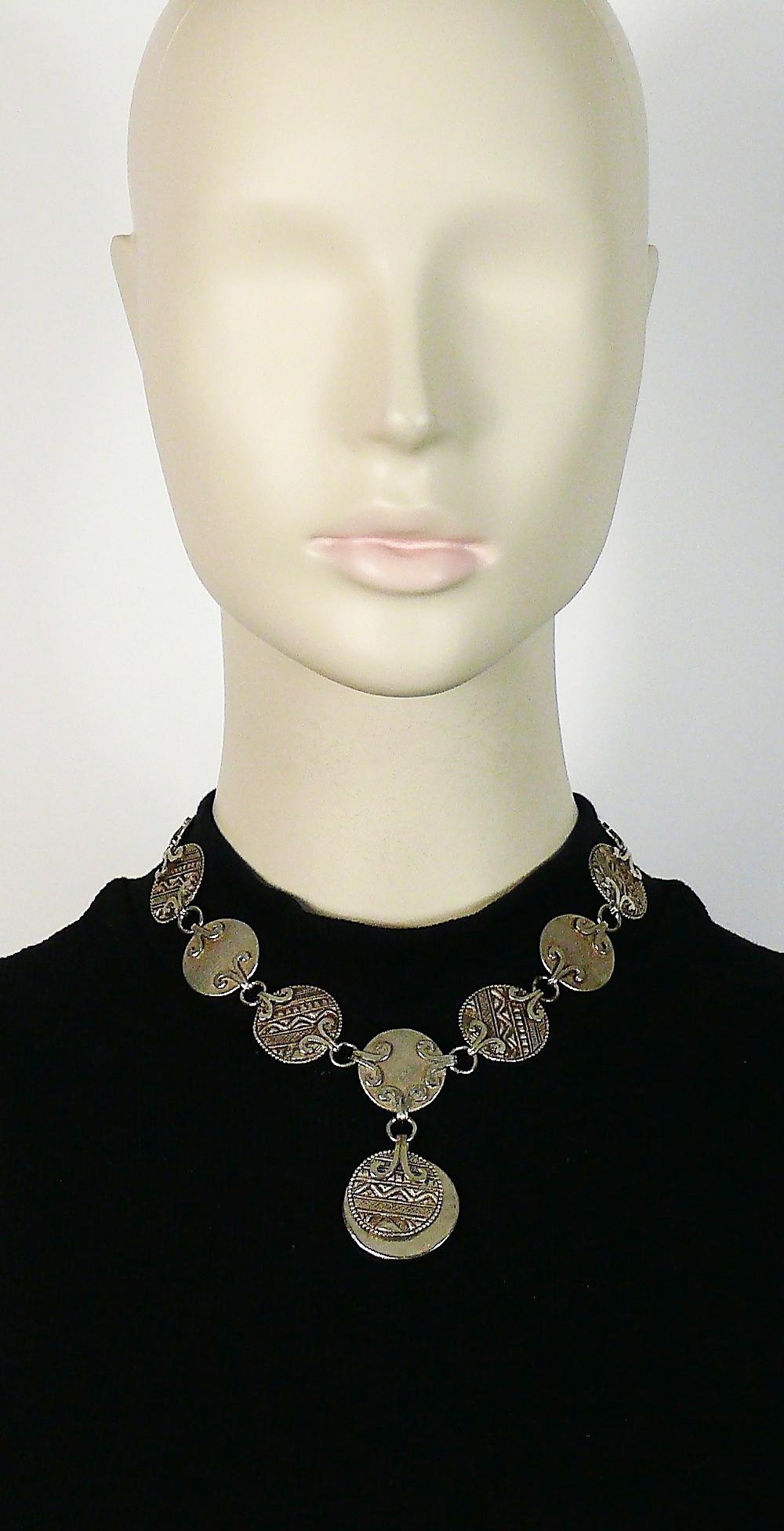 YVES SAINT LAURENT vintage antiqued silver tone disc links necklace featuring tuareg pattern inspired engravings.

Adjustable T-bar and toggle closure.

Embossed YSL Made in France.

Indicative measurements : adjustable length from approx 37 cm