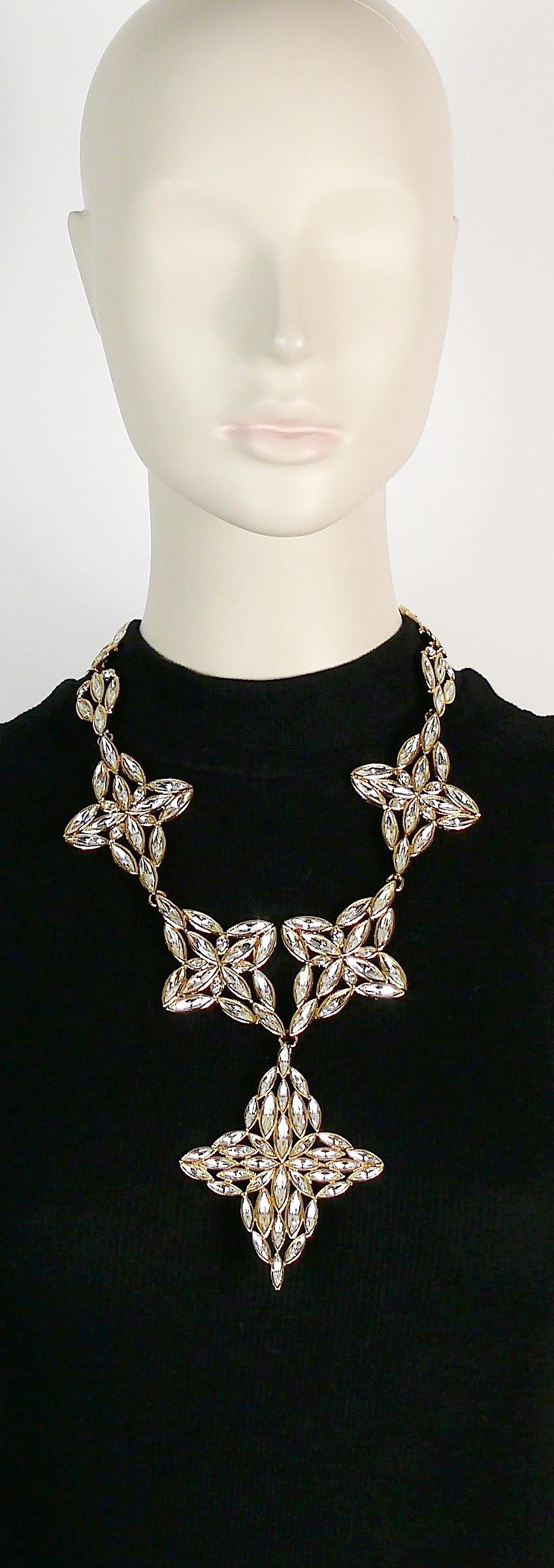 YVES SAINT LAURENT vintage gold toned statement necklace featuring stylized flowers embellished with clear crystals.

Lobster clasp closure.
Adjustable length.

Embossed YSL Made in France.

Indicative measurements : adjustable length from approx.