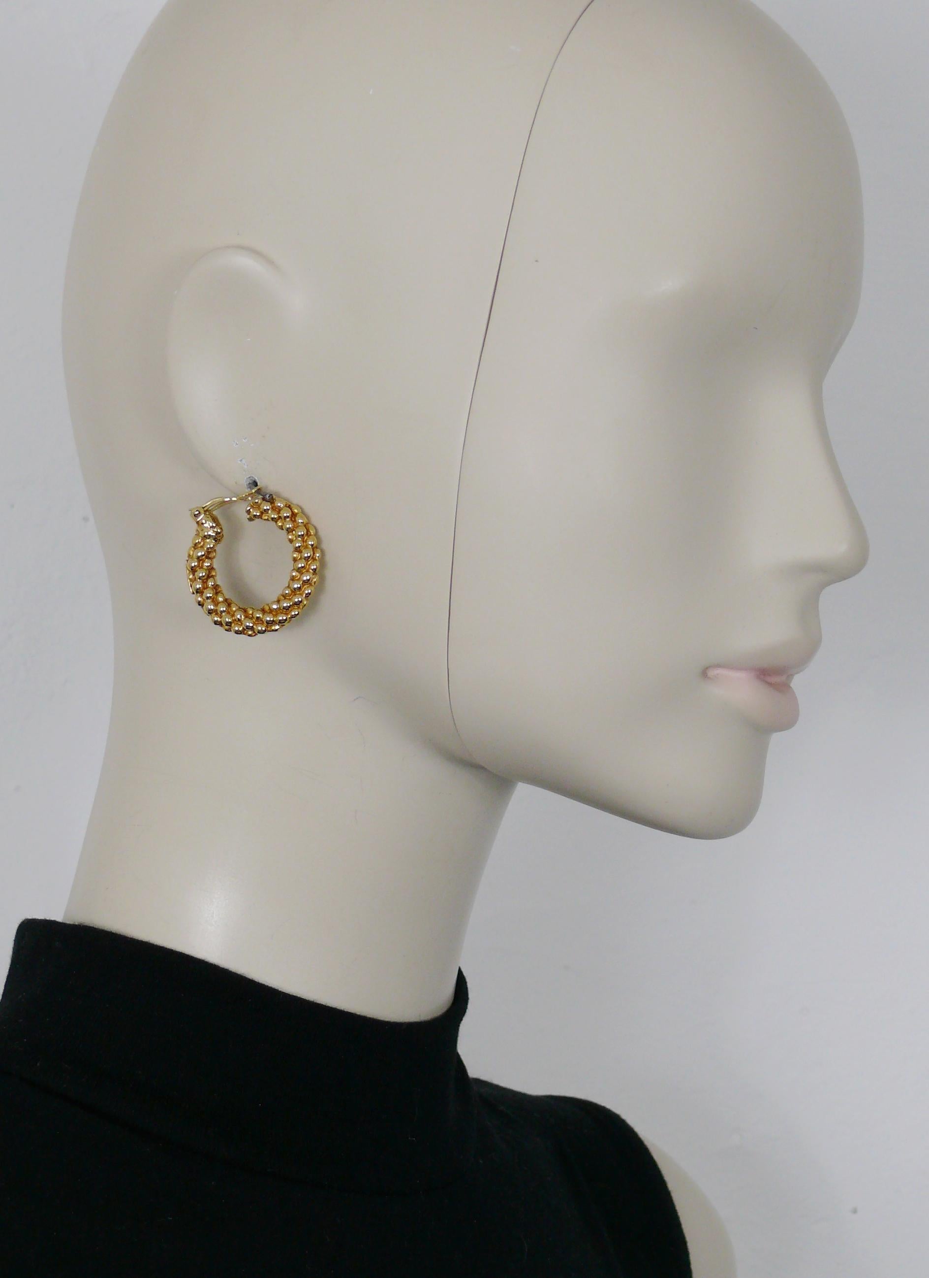 YVES SAINT LAURENT vintage gold toned textured hoop earrings (clip-on).

Embossed YSL Made in France.

Indicative measurements : diameter approx. 3 cm (1.18 inches).

JEWELRY CONDITION CHART
- New or never worn : item is in pristine condition with