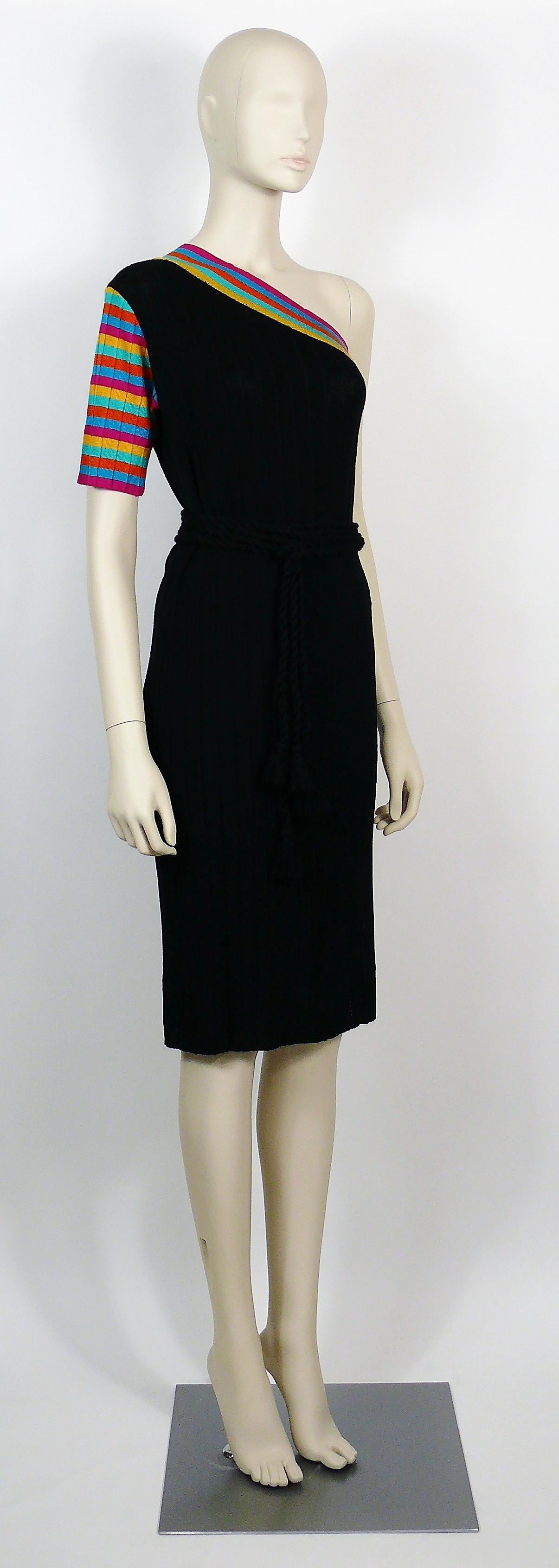 YVES SAINT LAURENT vintage tricot dress. 

This dress features :
- Knitted fabric in black with colorful stripes on the neckline, sleeve and side slit.
- Straight cut.
- One shoulder.
- Side slit.
- Original matching tassel black belts (2