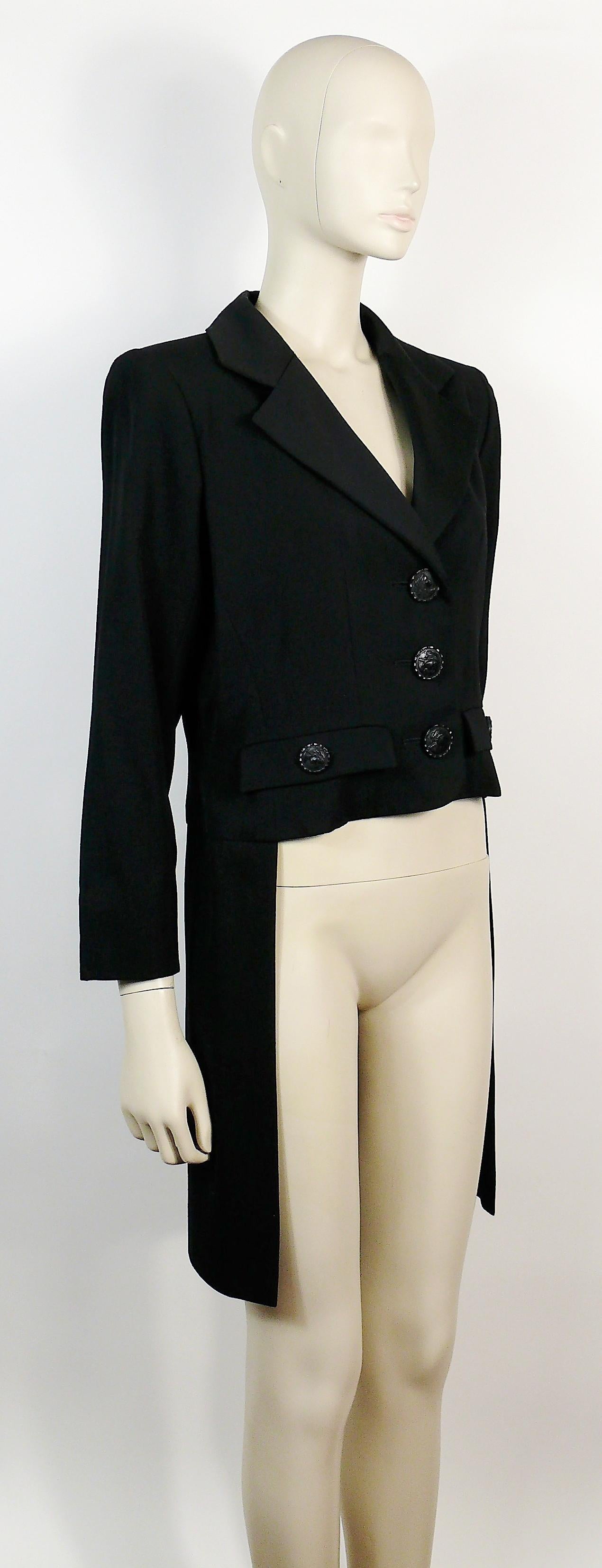 YVES SAINT LAURENT vintage rare black tuxedo tailcoat.

This tail coat features :
- Black satin notched collar.
- Black resin female profile front buttoning.
- Matching buttons on faux pockets an cuffs.
- Two faux pockets.
- Shoulder pads.
- Fully