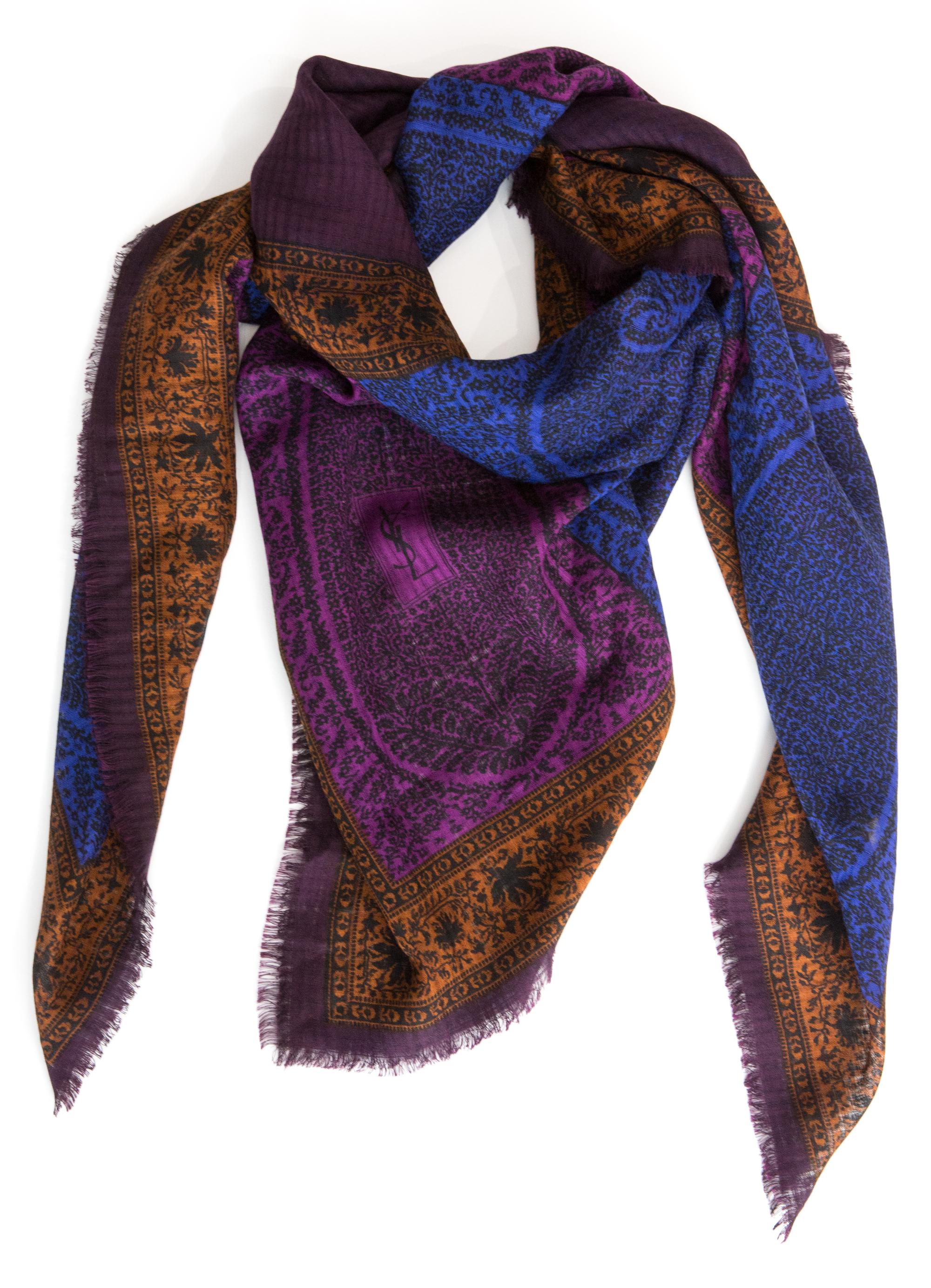 Yves Saint Laurent YSL wool & silk shawl featuring a paisley print, a woven ground, fringed edges, and a YSL signature. 
65%wool, 35%silk
Circa 1970s
In good vintage condition. Made in France.
55.1 in. (140 cm) X 55.1 in. (140 cm)
We guarantee you