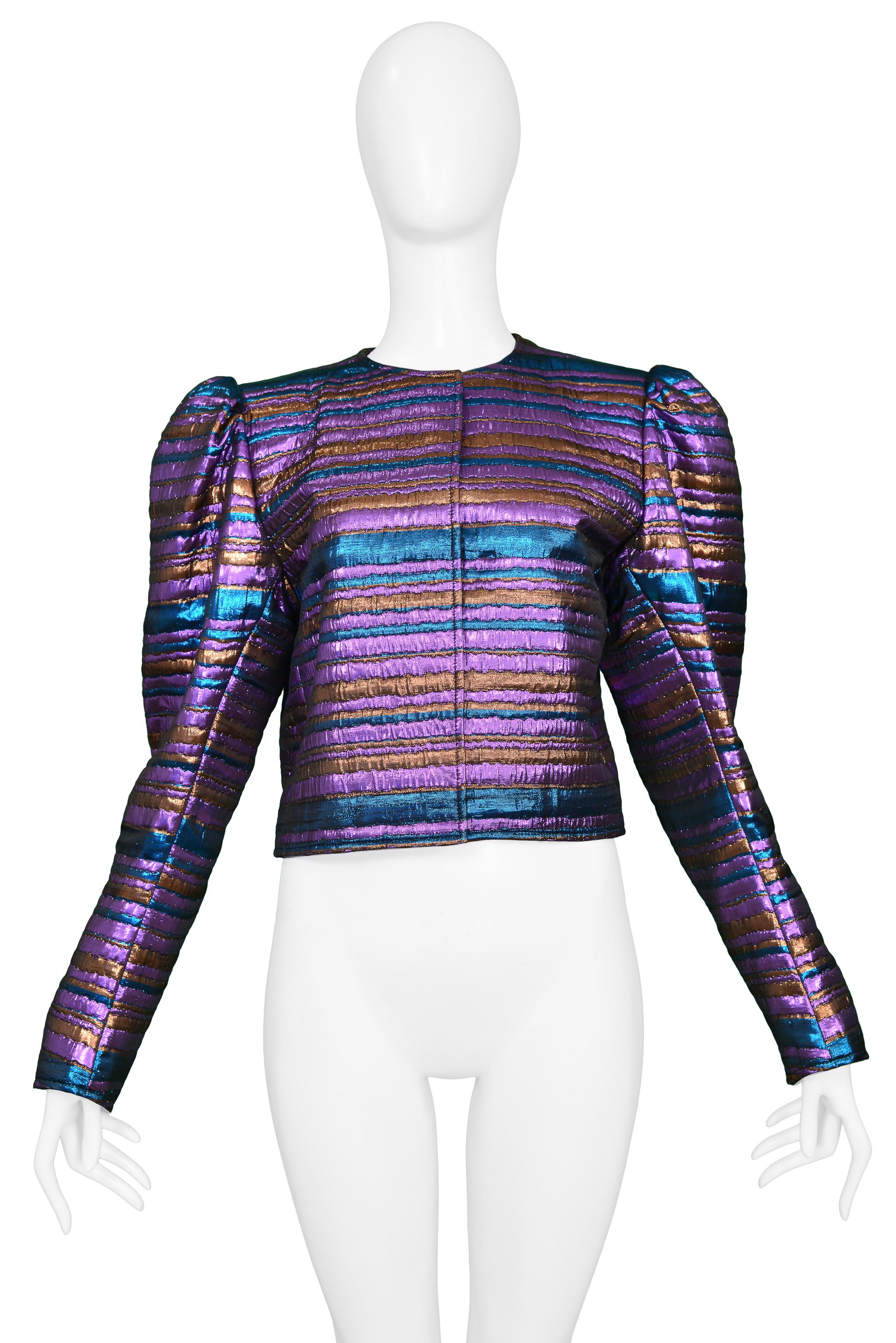 Resurrection Vintage is excited to present a vintage blue, purple, and copper Yves Saint Laurent YSL metallic striped disco jacket featuring cropped body, princess sleeves, and a closed collar. 

Yves Saint Laurent
Size: 42
Metallic Woven