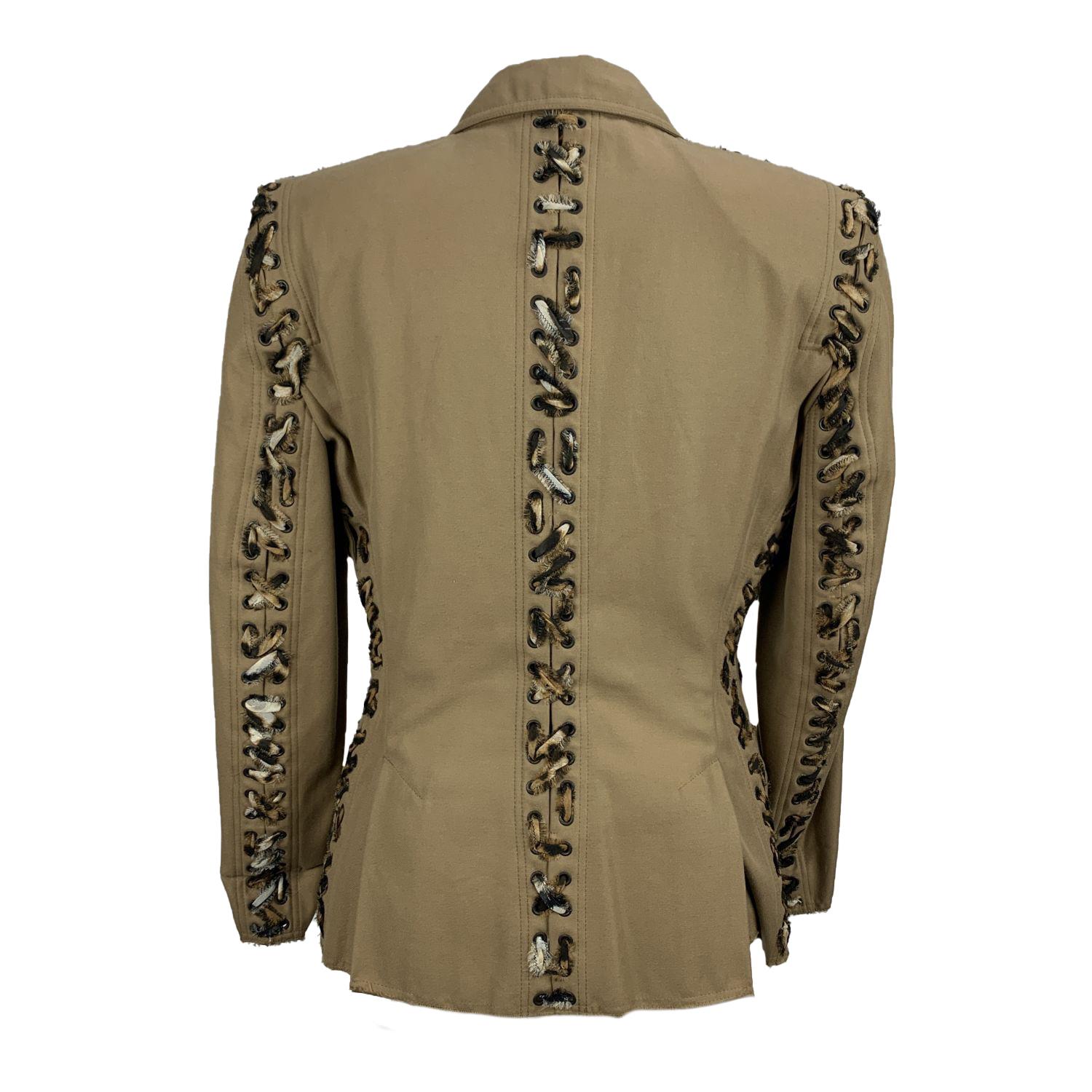 Yves Saint Laurent fitted blazer. Composition: 100% Cotton. Color: Beige. Long sleeves. Notch lapel collar. Hits around hips. Animal print lace up detail. Front welt pockets. Padded shoulders. Front hook-and-eye closure. Unlined. Size: 36 FR (The